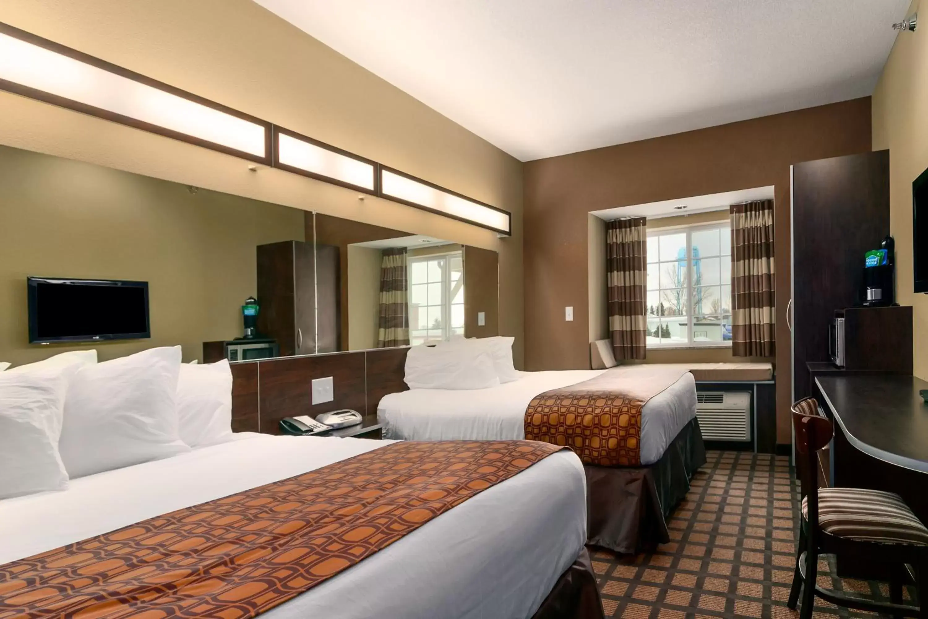 Bed in Microtel Inn & Suites by Wyndham Minot