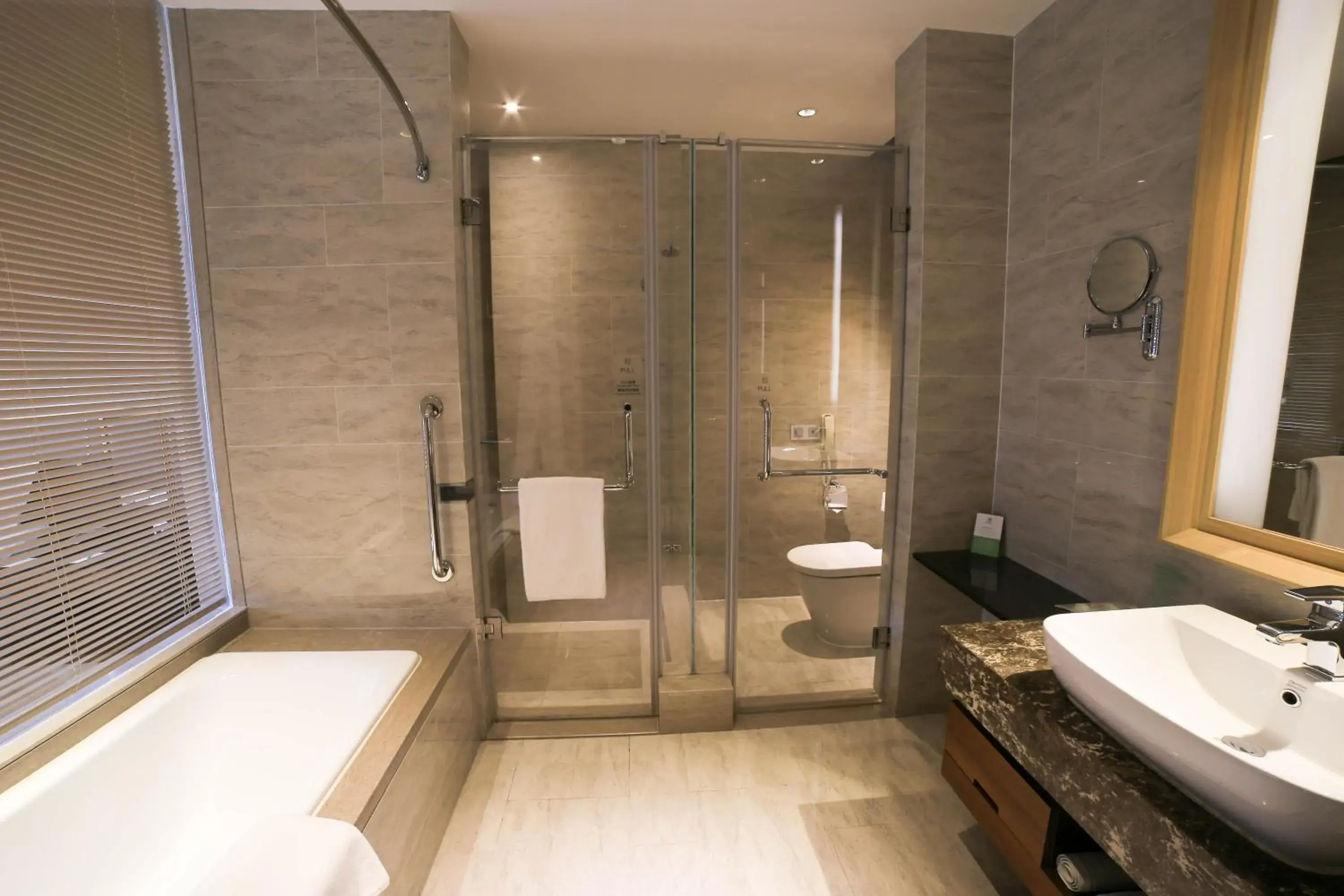 Toilet, Bathroom in Holiday Inn Qingdao Expo, an IHG Hotel