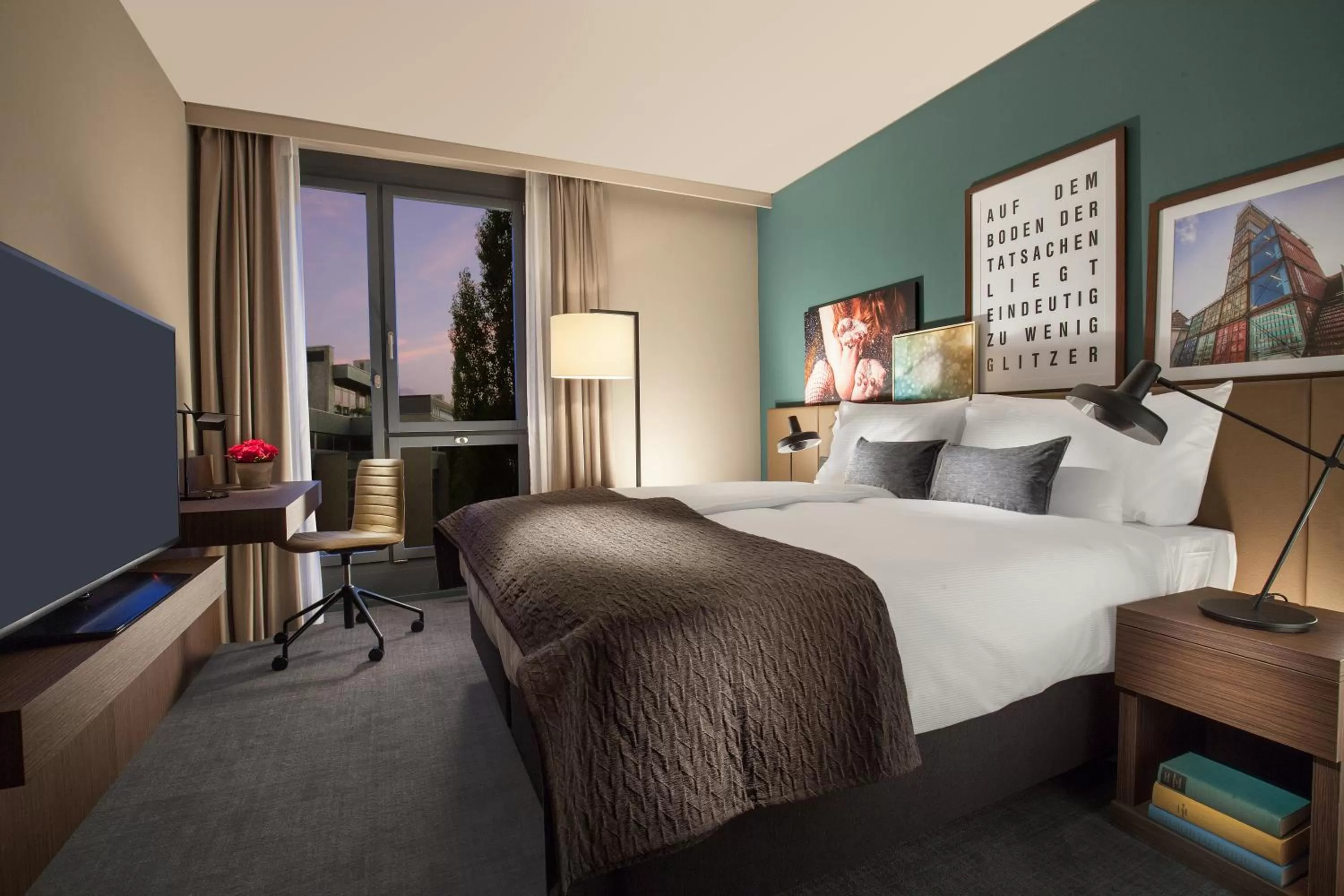 Seating area, Bed in Acasa Suites Zurich Oerlikon