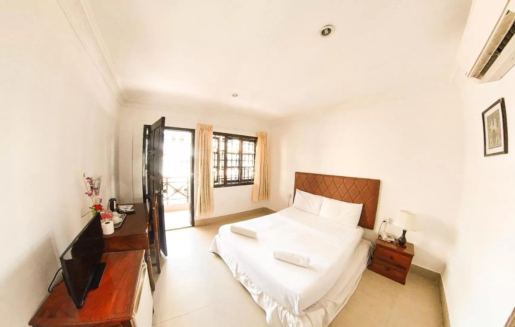 Bed in Riverside Hotel Phnom Penh