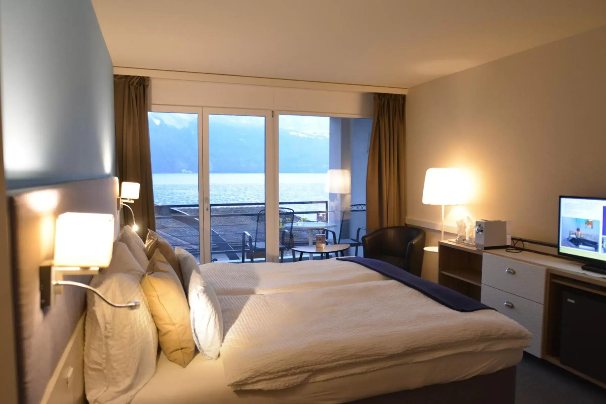 Bed in Seehotel Riviera at Lake Lucerne