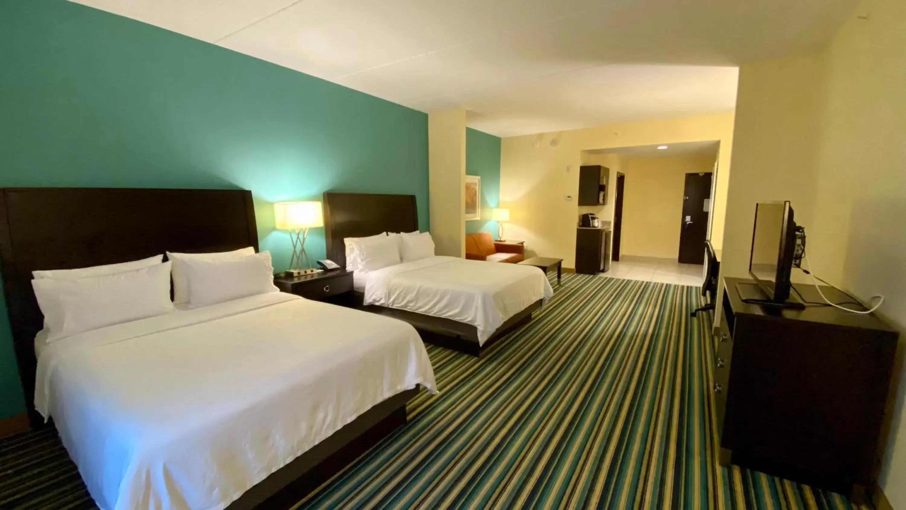 Photo of the whole room, Bed in Holiday Inn Express Hotel & Suites Orlando East-UCF Area, an IHG Hotel