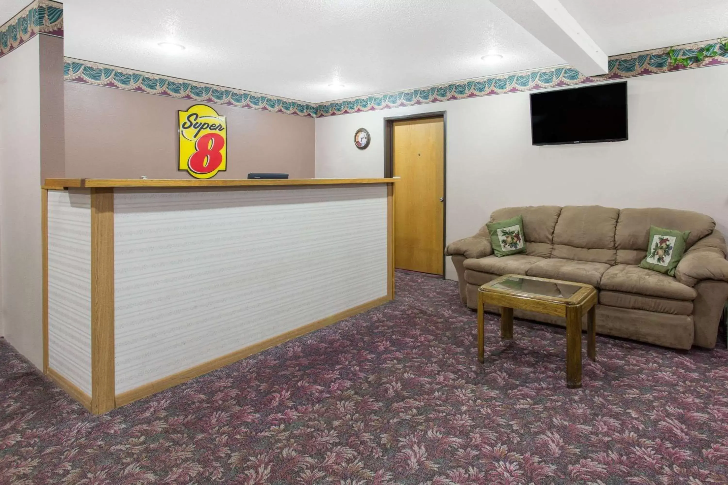 Lobby or reception in Super 8 by Wyndham Austin MN Lobby or reception in Super 8 by Wyndham Austin MN