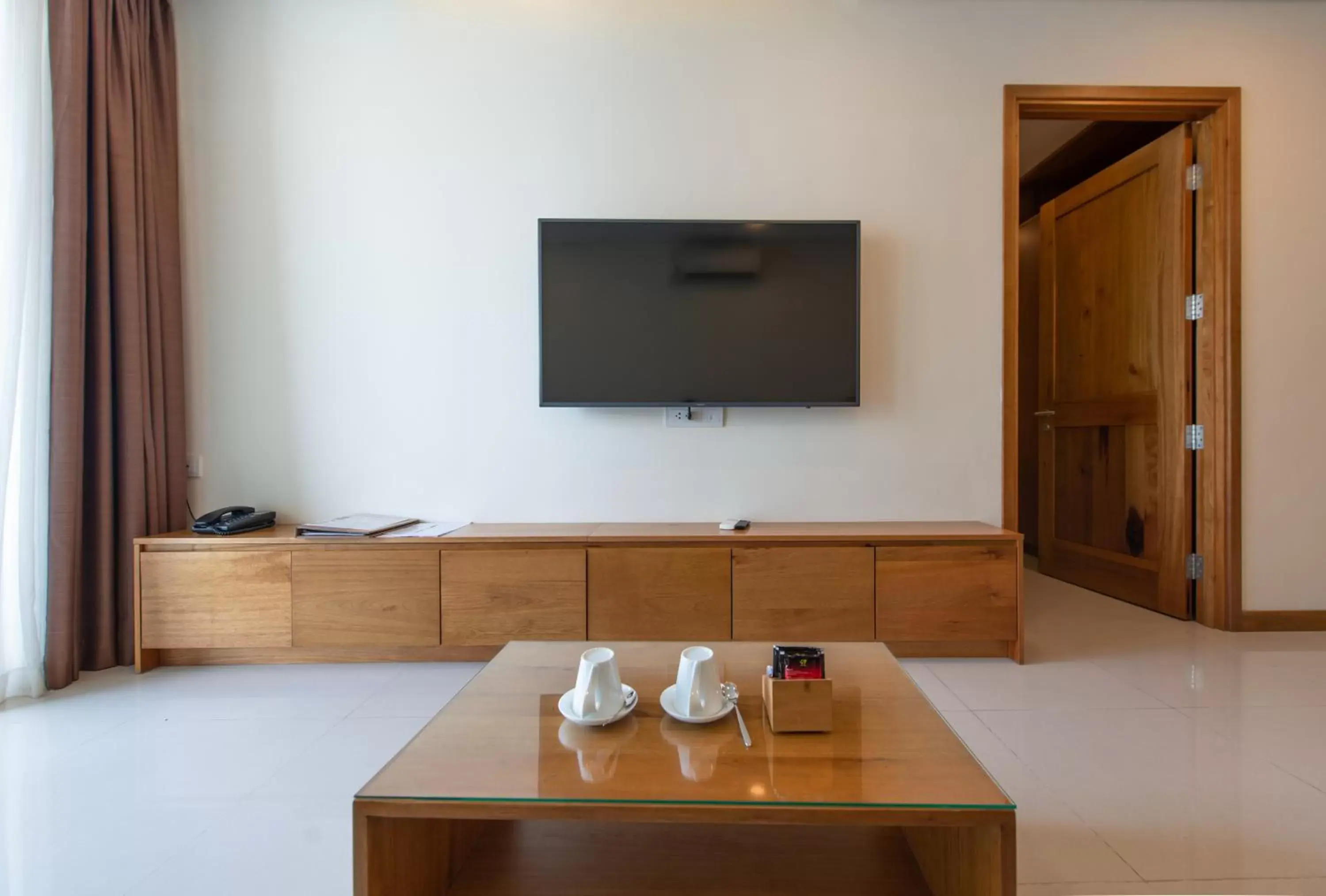 TV and multimedia, TV/Entertainment Center in Maple Hotel & Apartment