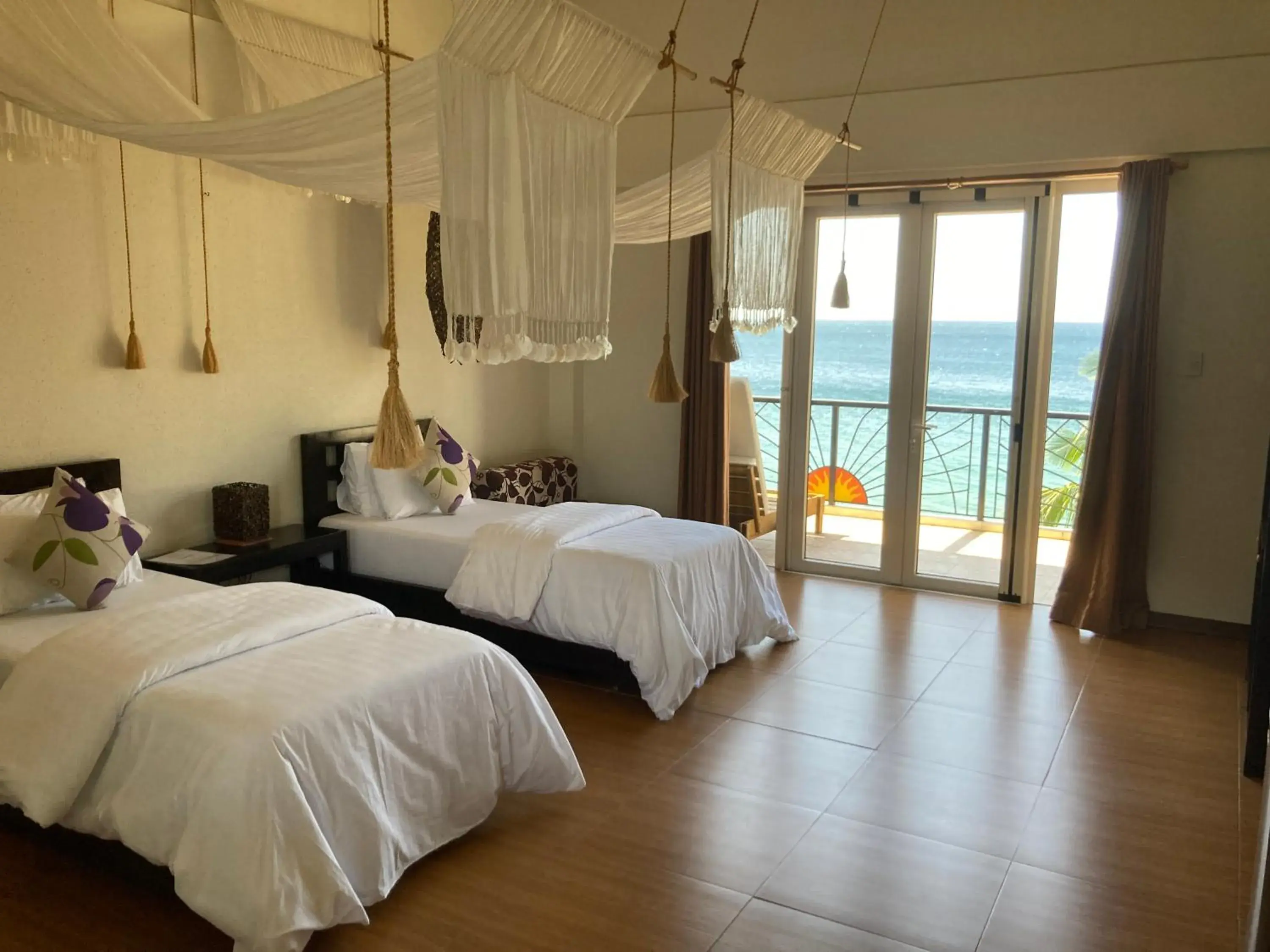 Photo of the whole room, Bed in Sunset At Aninuan Beach Resort