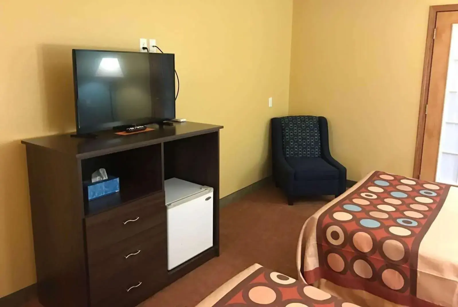 Photo of the whole room, TV/Entertainment Center in Super 8 by Wyndham Plover Stevens Point Area