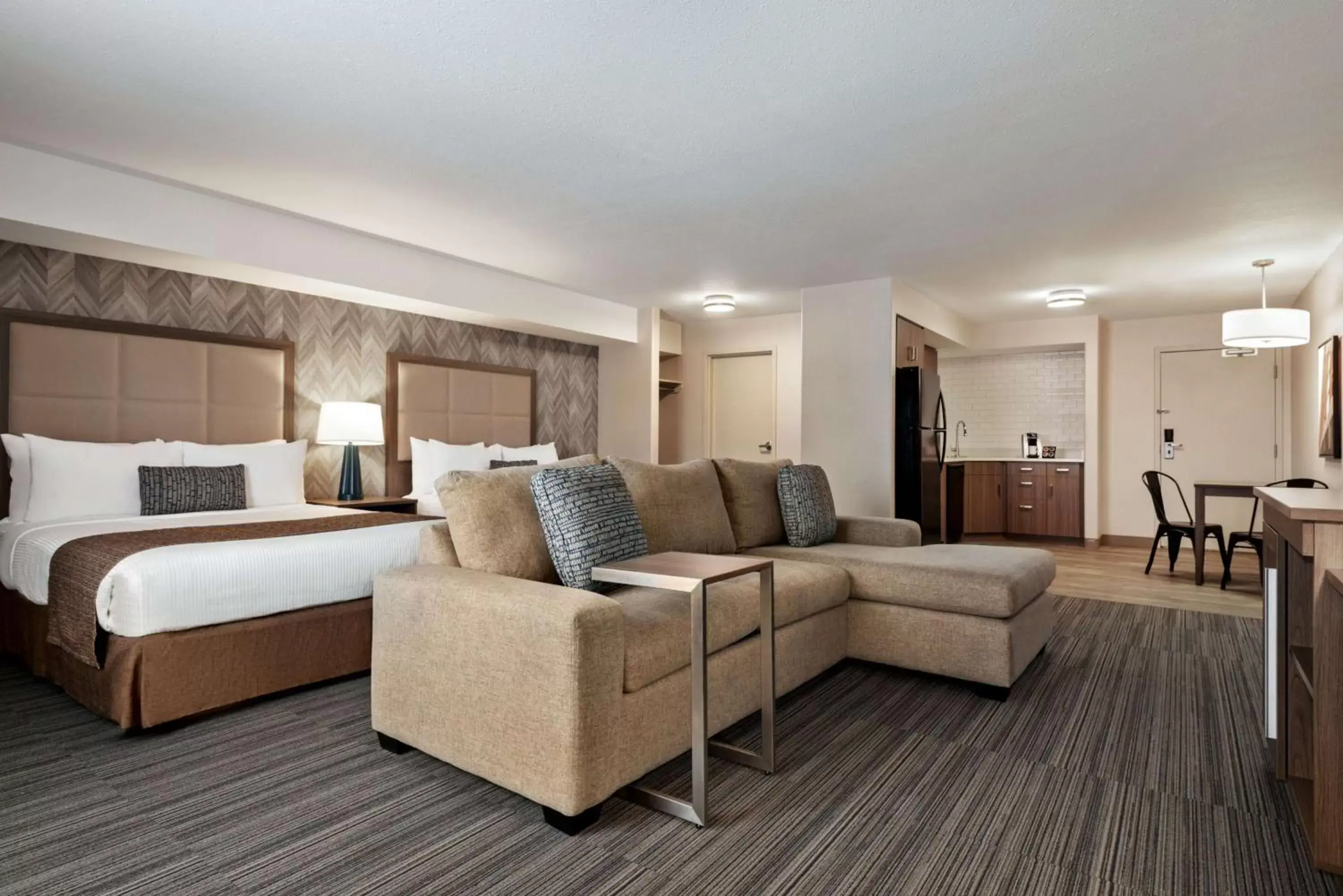 Photo of the whole room, Seating Area in Ramada by Wyndham Airdrie Hotel & Suites