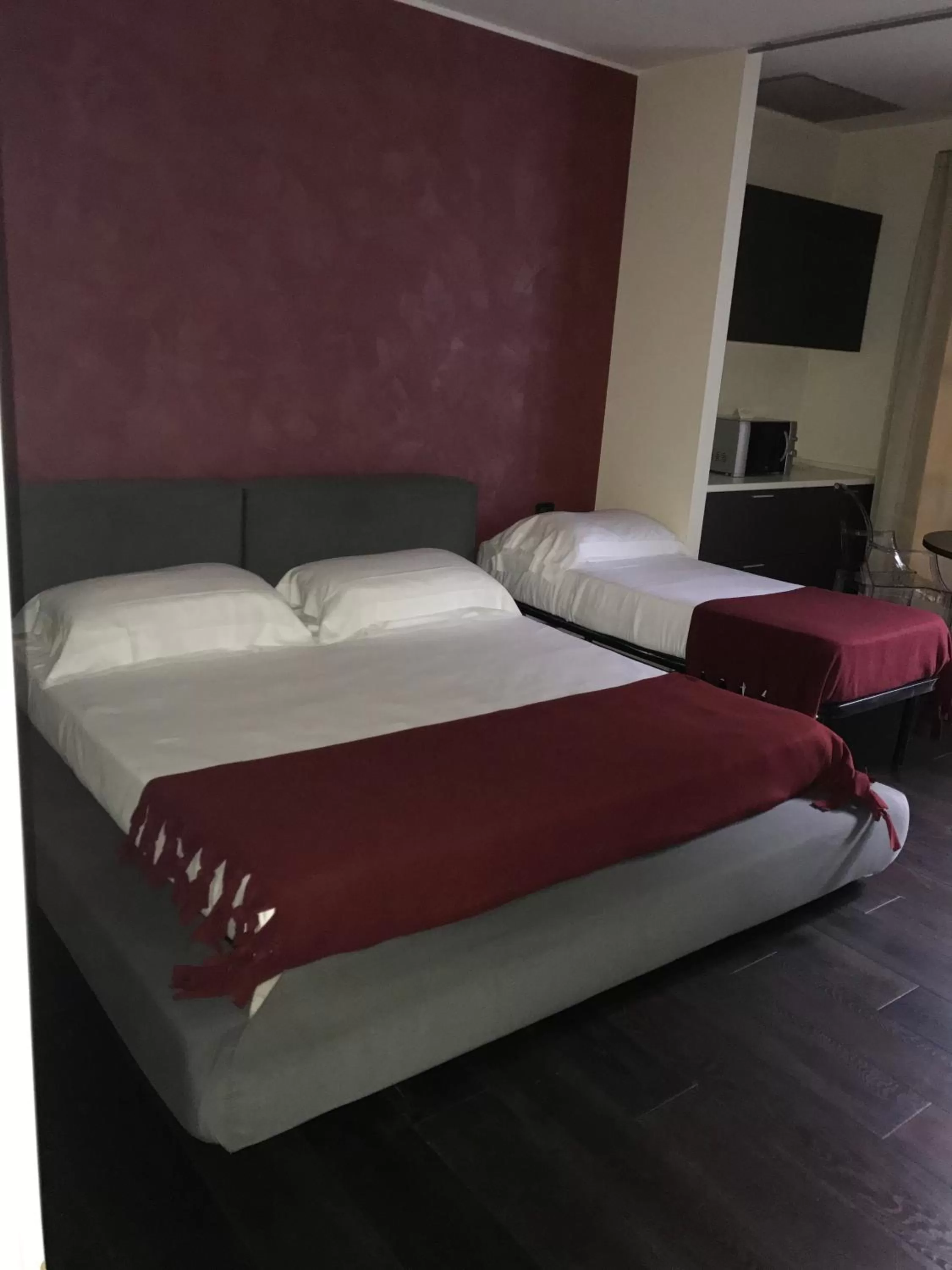 Bed in Joia Hotel & Luxury Apartments RTA