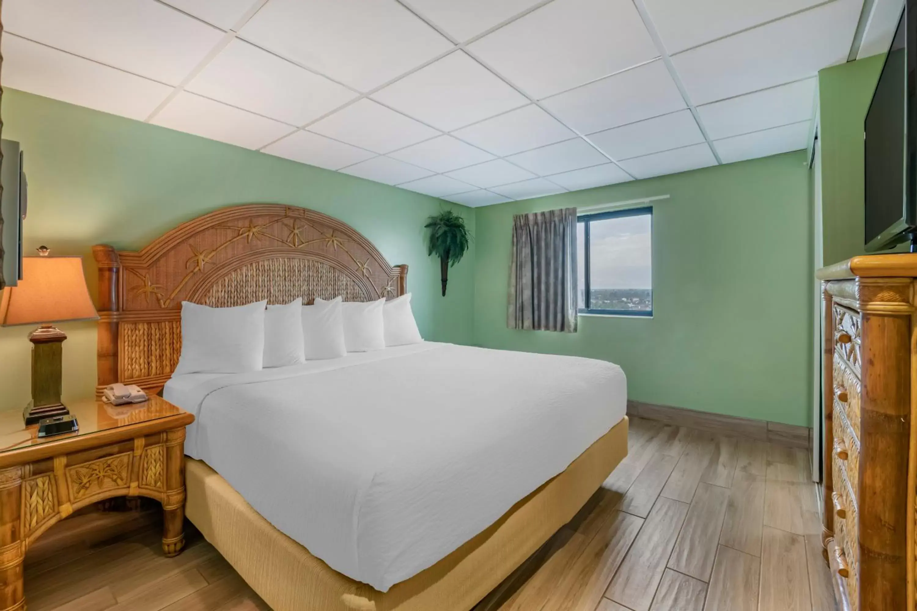 Bed in Tropical Winds Resort Hotel