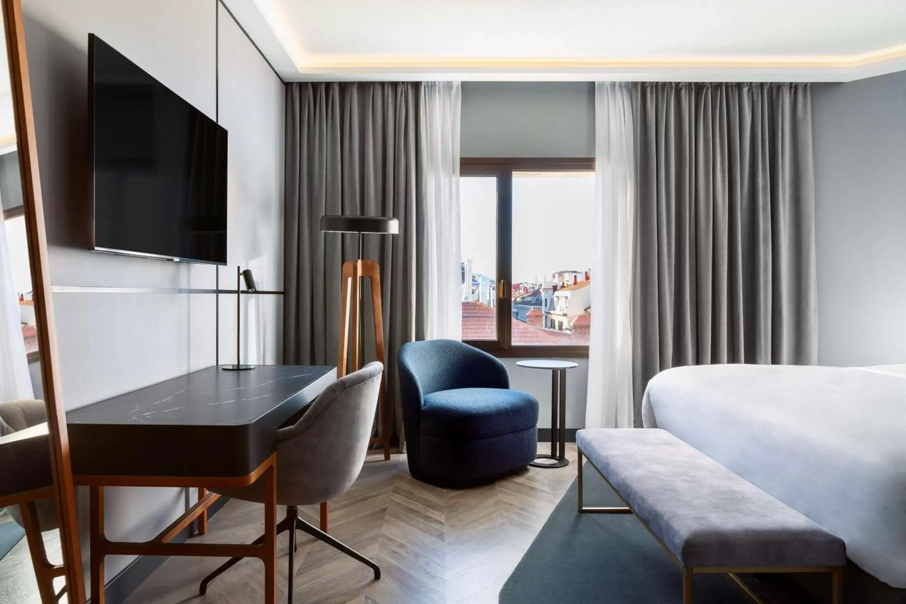 Bed, Seating Area in Radisson Collection Bilbao