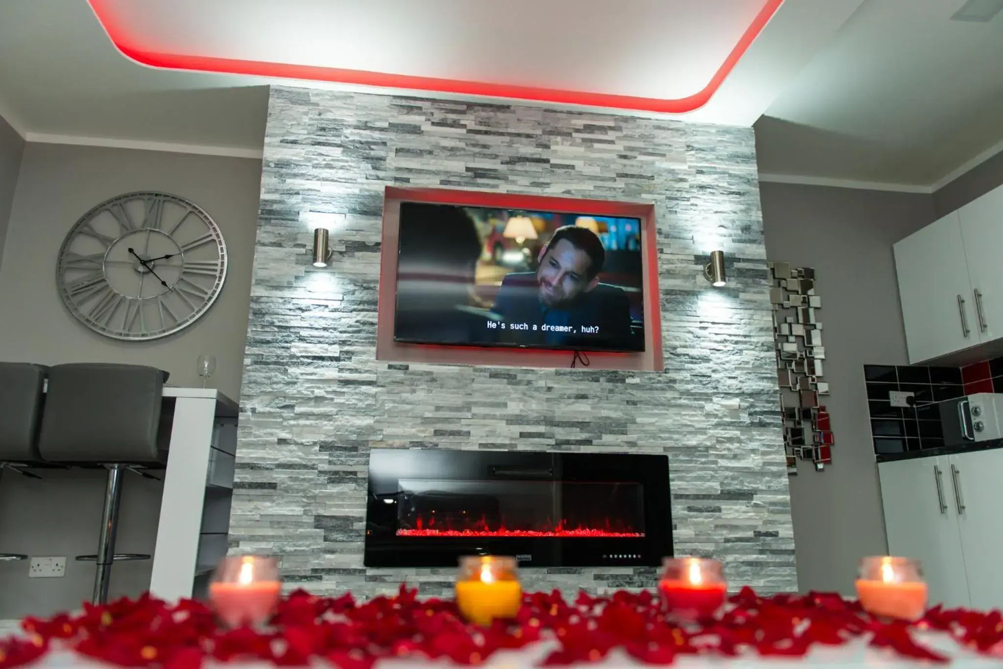 Living room, TV/Entertainment Center in Aphrodite Suites