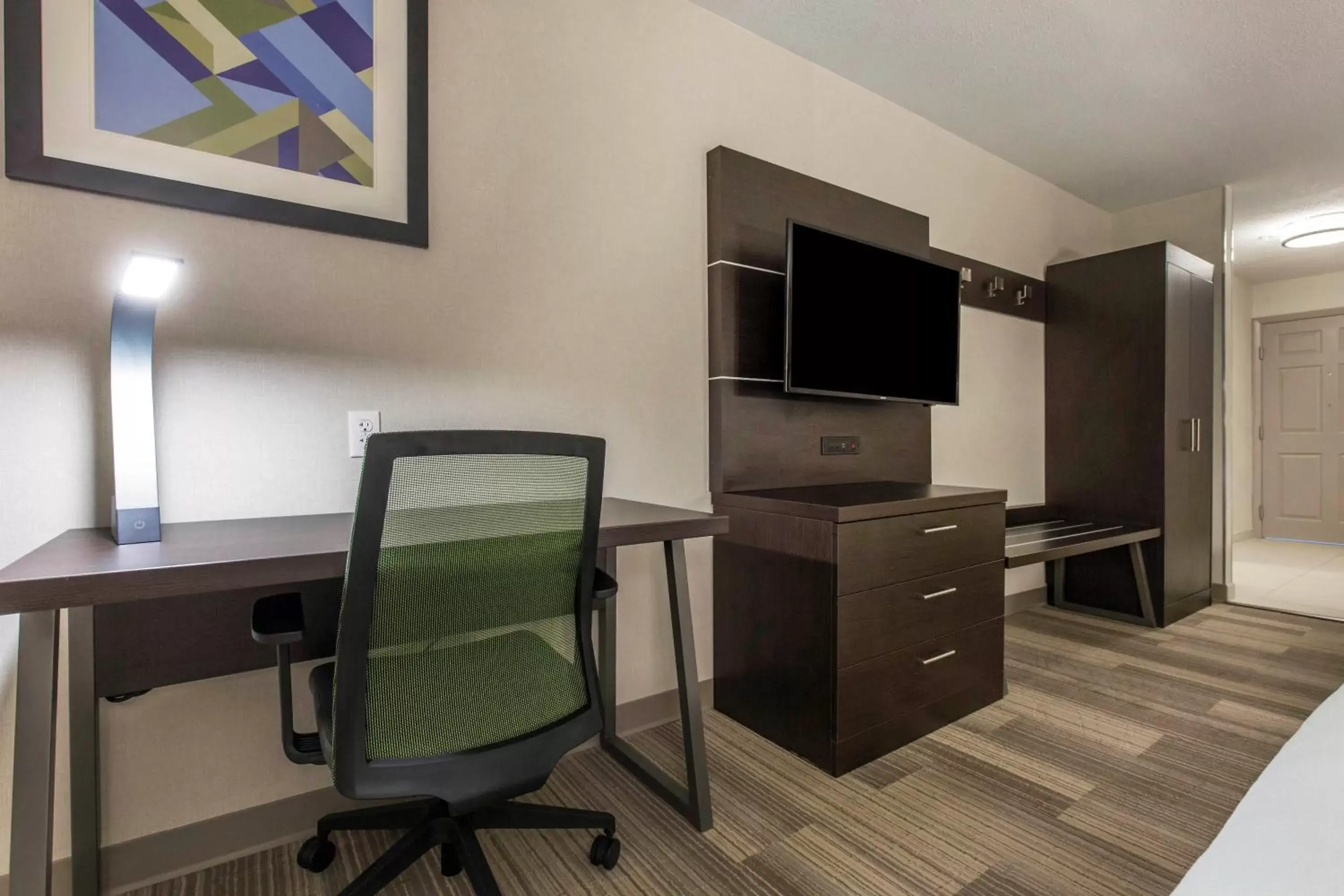 Photo of the whole room, TV/Entertainment Center in Holiday Inn Express and Suites Chicago West - St Charles, an IHG Hotel