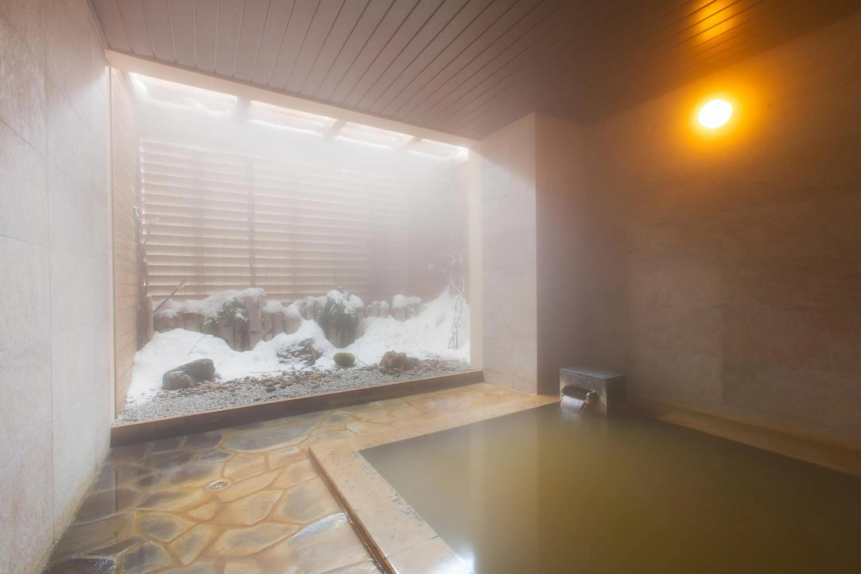 Hot Spring Bath in Chalet Ivy Hirafu, Niseko