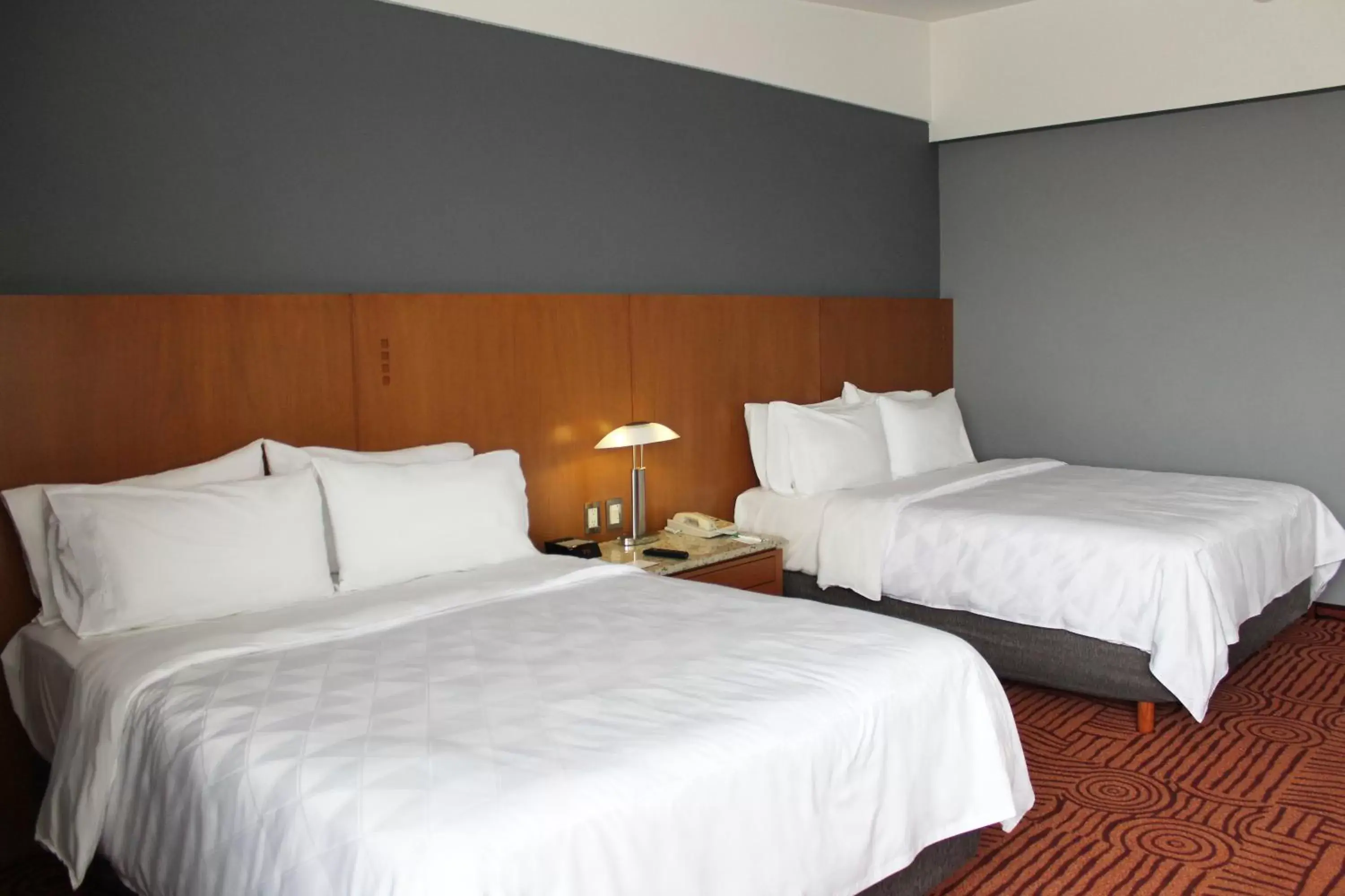 Bed in Holiday Inn Puebla Finsa, an IHG Hotel