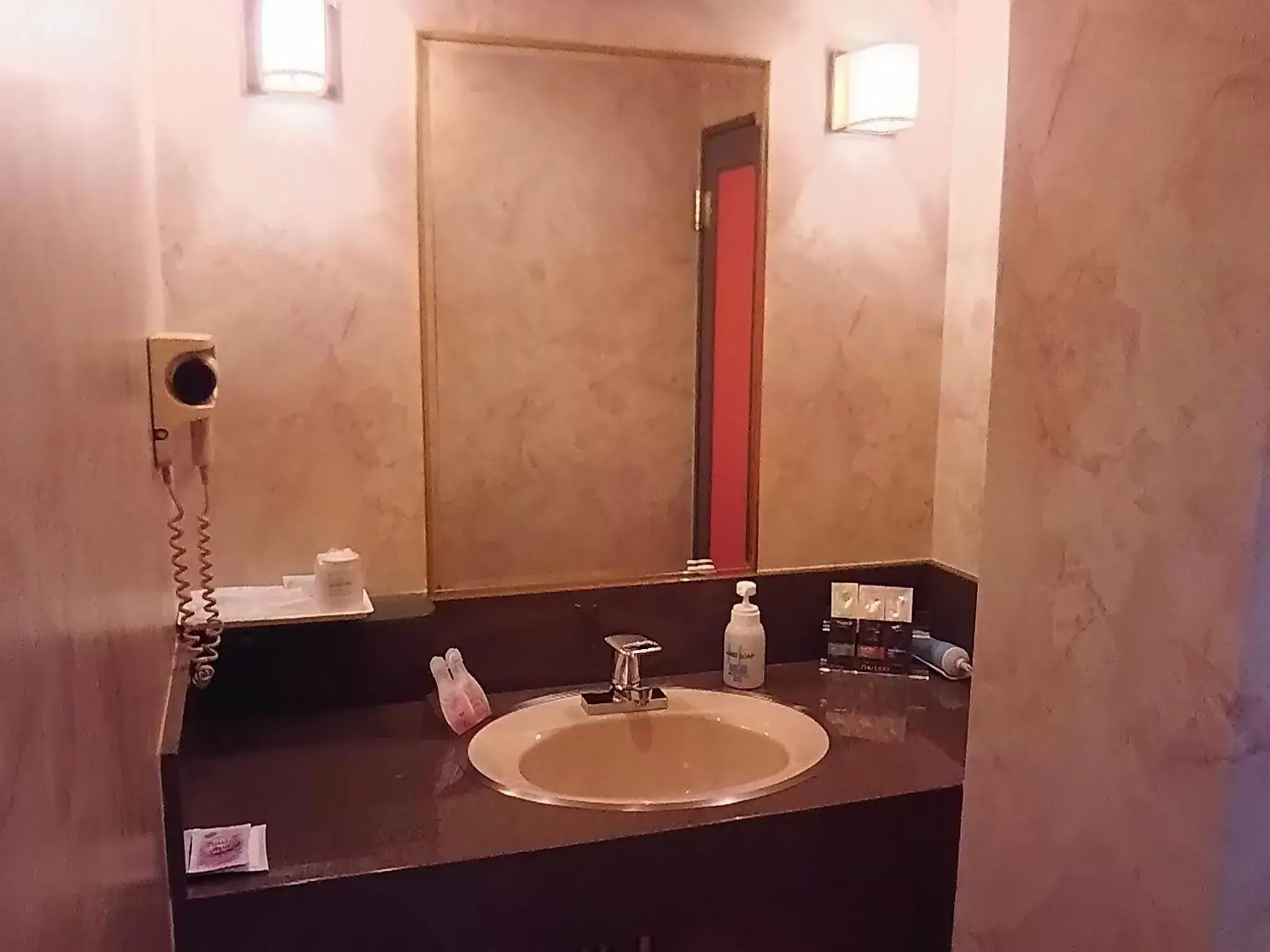 Photo of the whole room, Bathroom in Hotel Sting