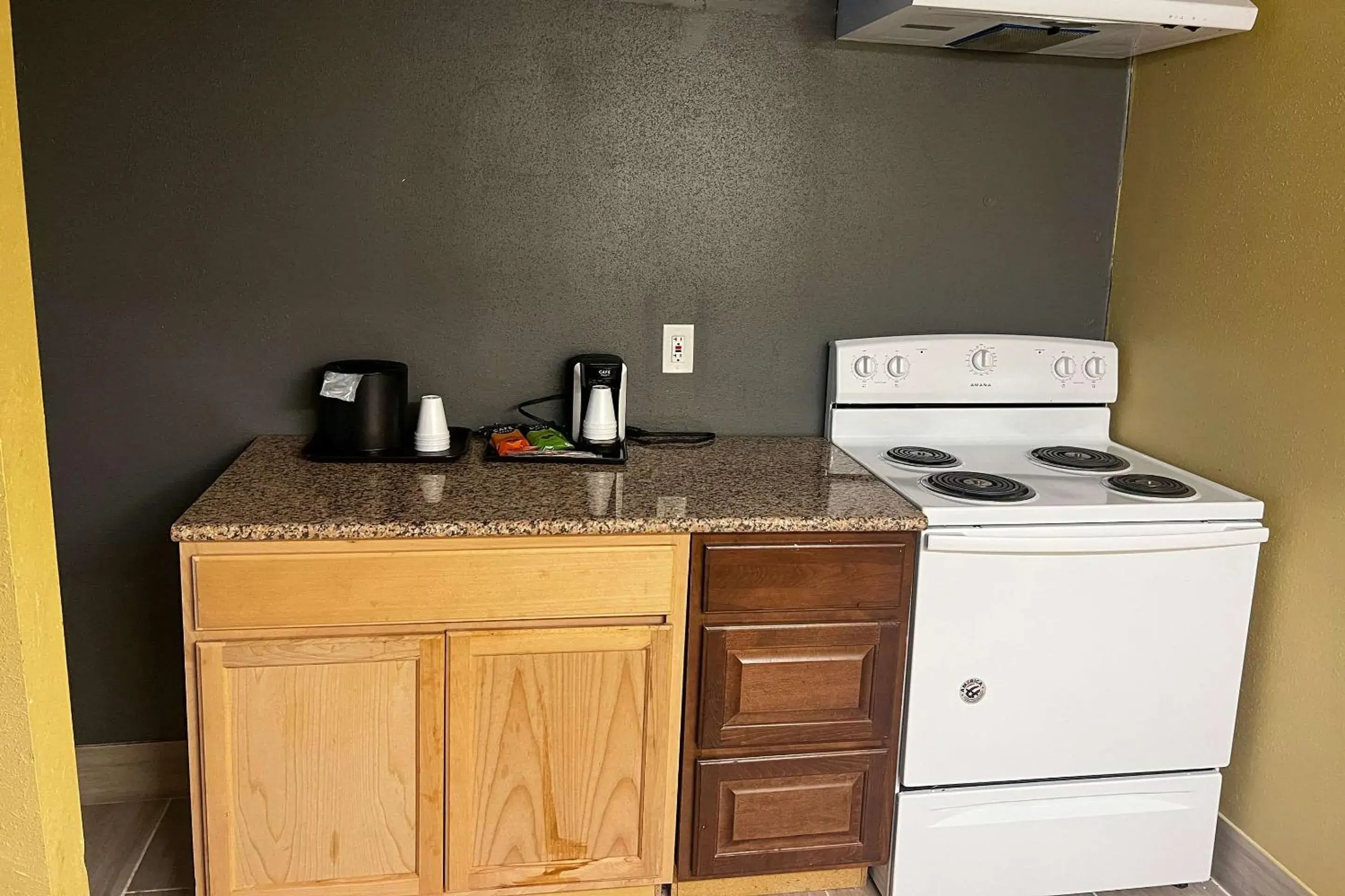 Bedroom, Kitchen/Kitchenette in Clarion Inn & Suites