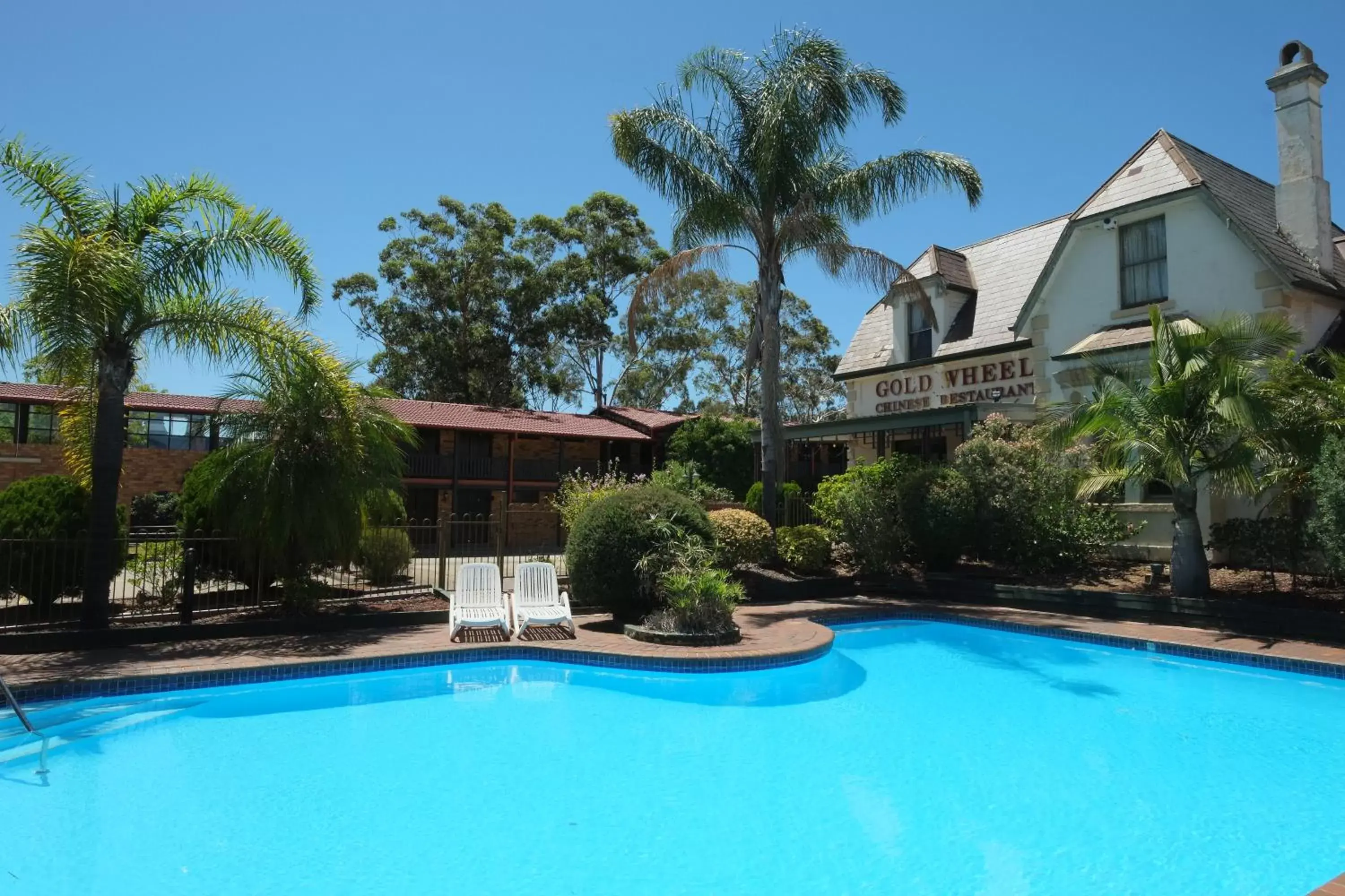 Swimming pool, Property Building in Maclin Lodge Motel