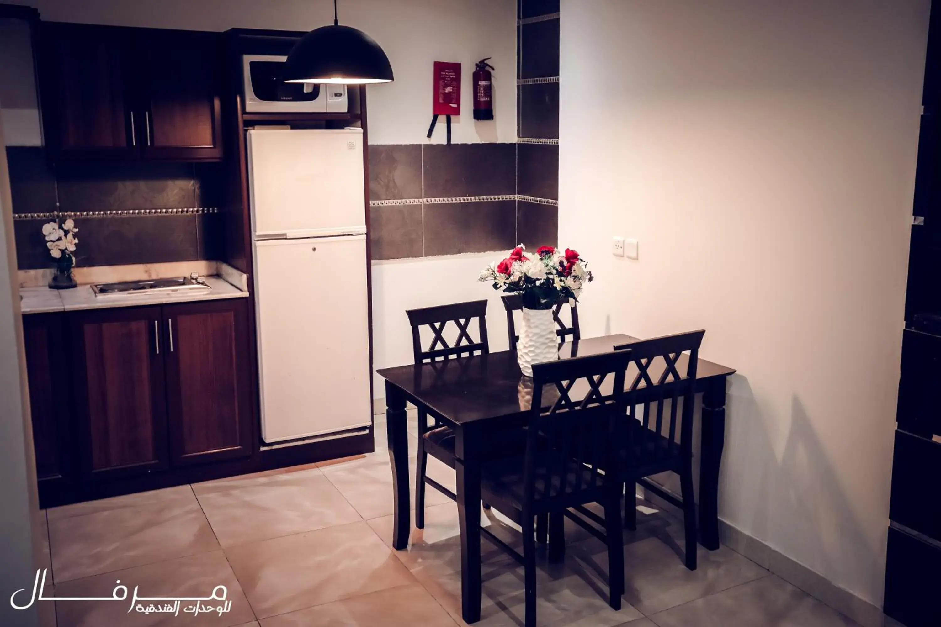 Kitchen or kitchenette, Dining Area in Merfal Hotel Apartments Al Taawan