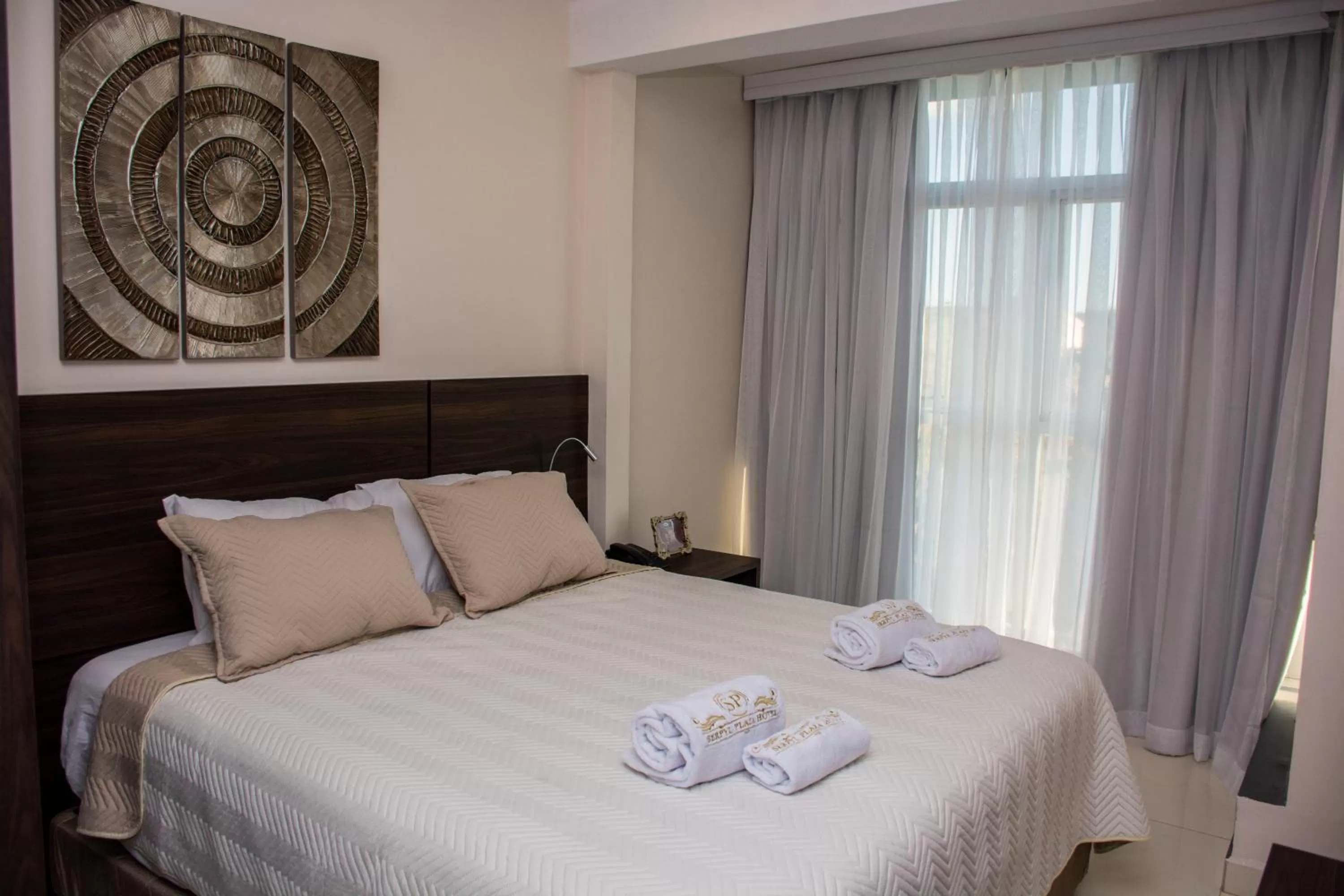 Bed in SERPYL Plaza Hotel