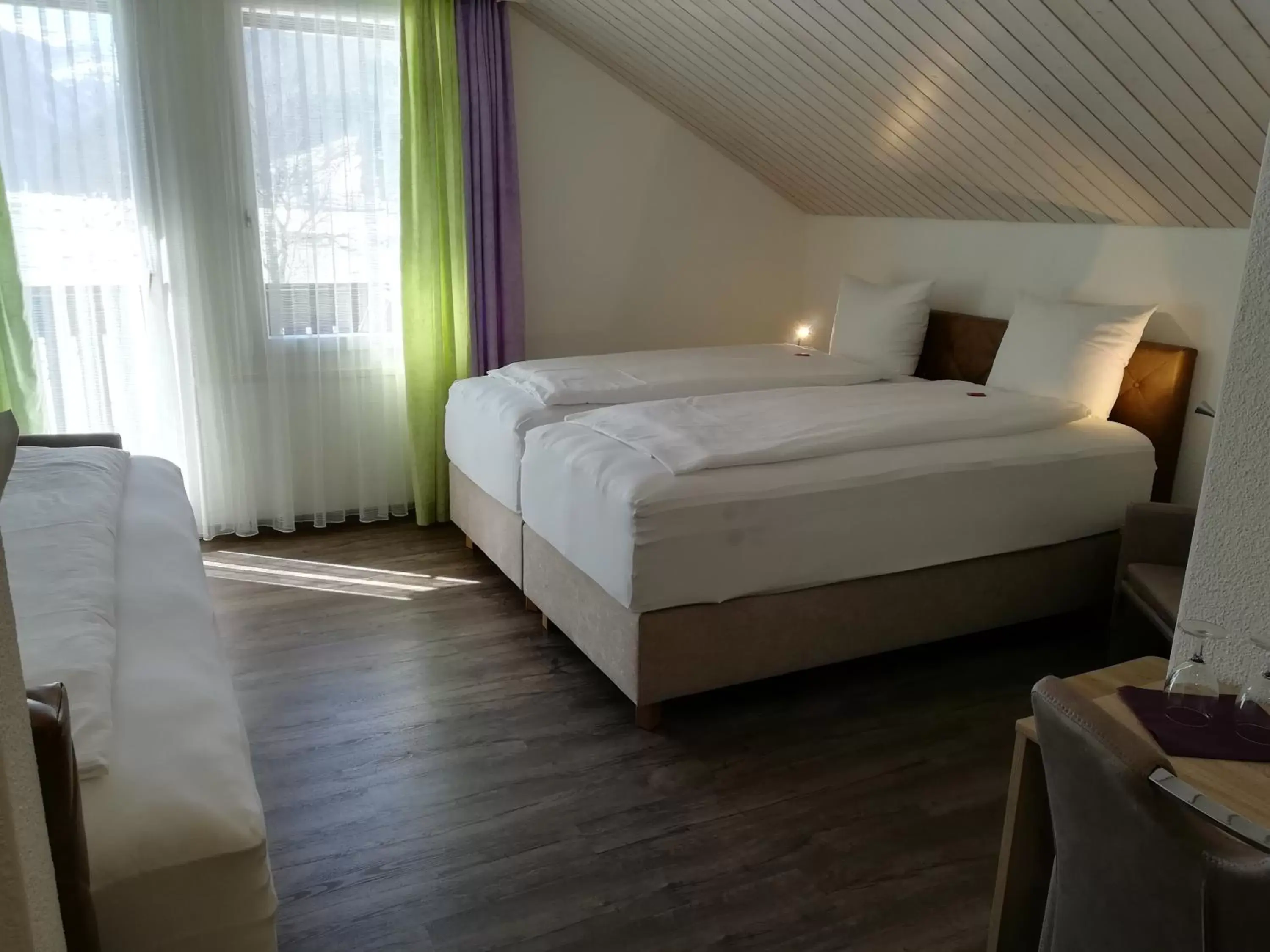 Photo of the whole room, Bed in Hotel Rhodannenberg AG