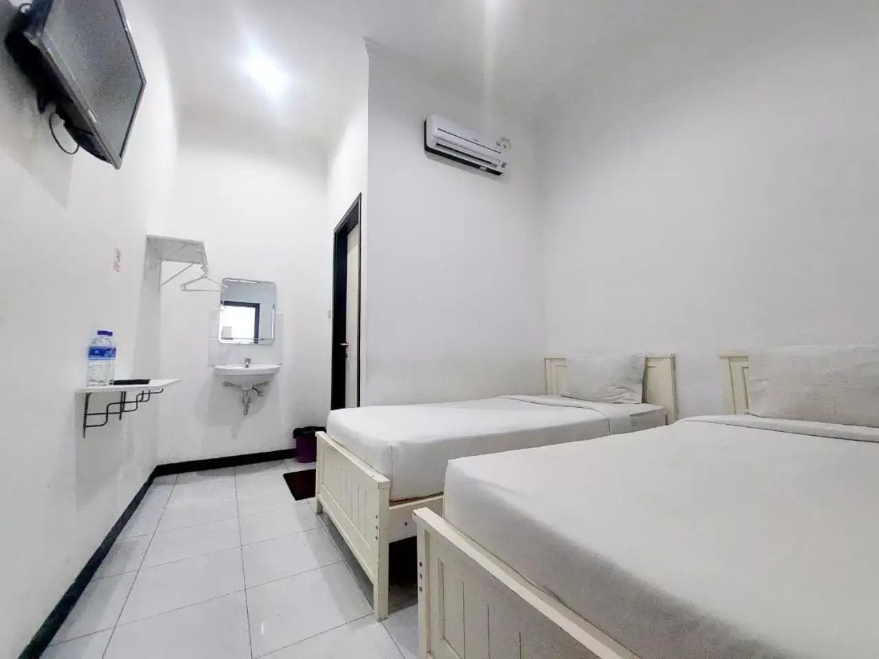 Toilet, Bed in COZY STAY KUPANG