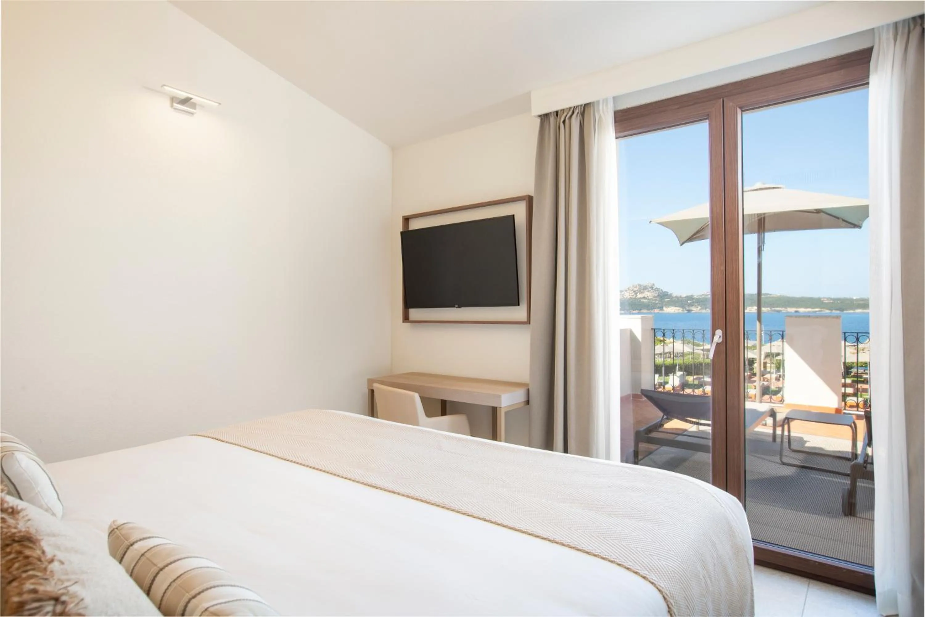 Bed in Mangia's Santa Teresa Sardinia, Curio Collection by Hilton