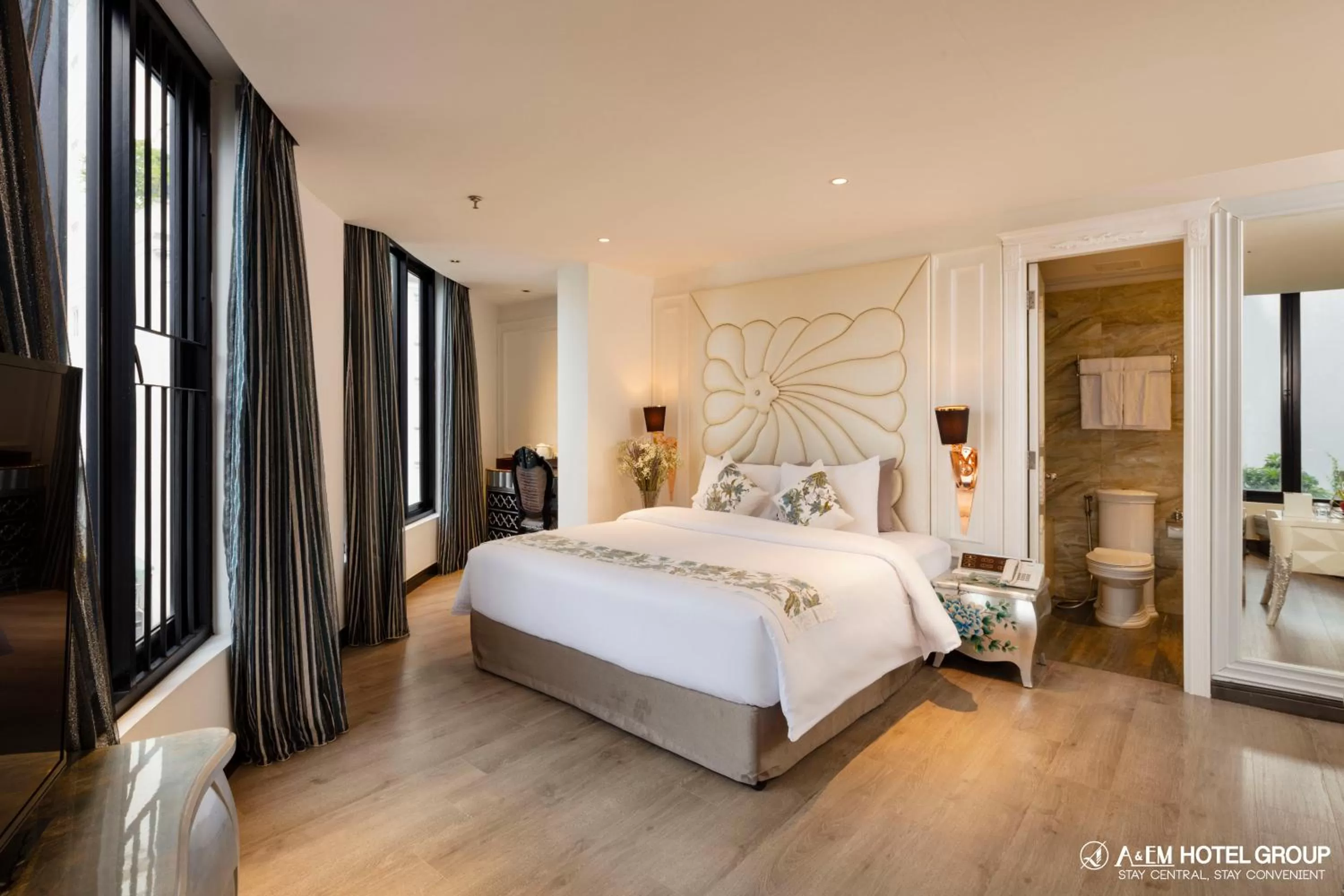 Bed in A&EM Saigon Hotel