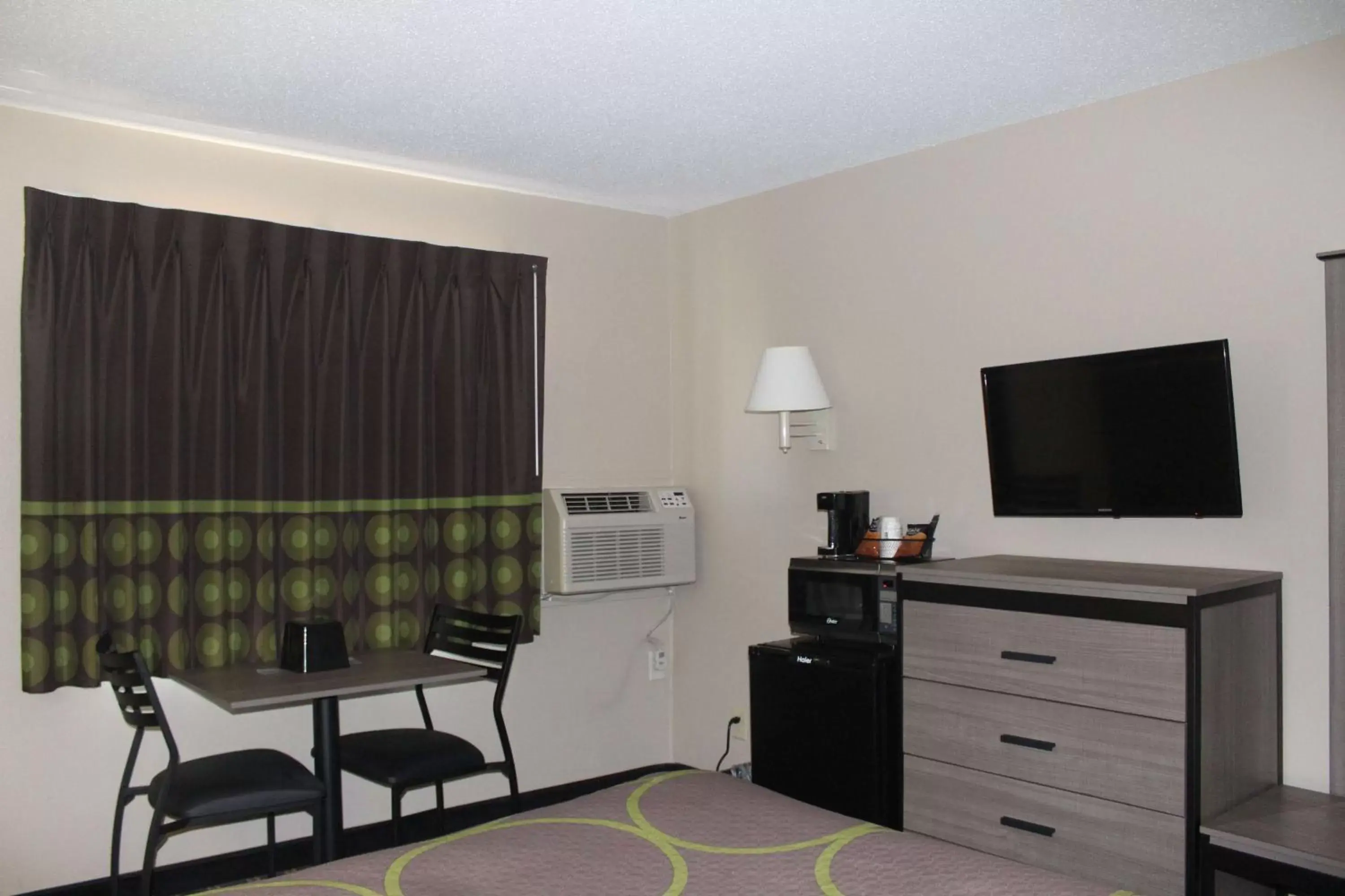 Photo of the whole room, TV/Entertainment Center in Super 8 by Wyndham Michigan City