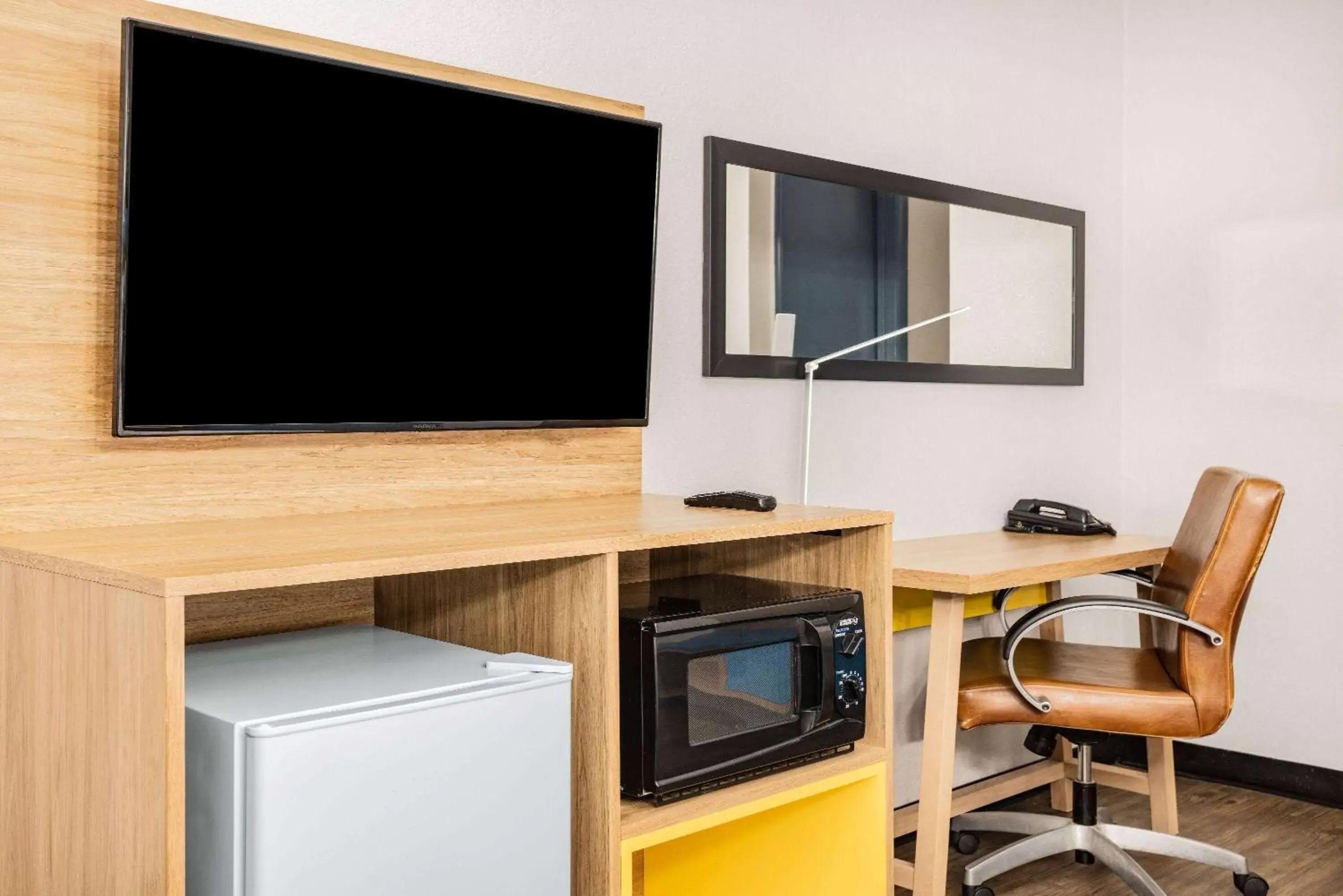 Photo of the whole room, TV/Entertainment Center in Days Inn by Wyndham Raleigh Glenwood-Crabtree