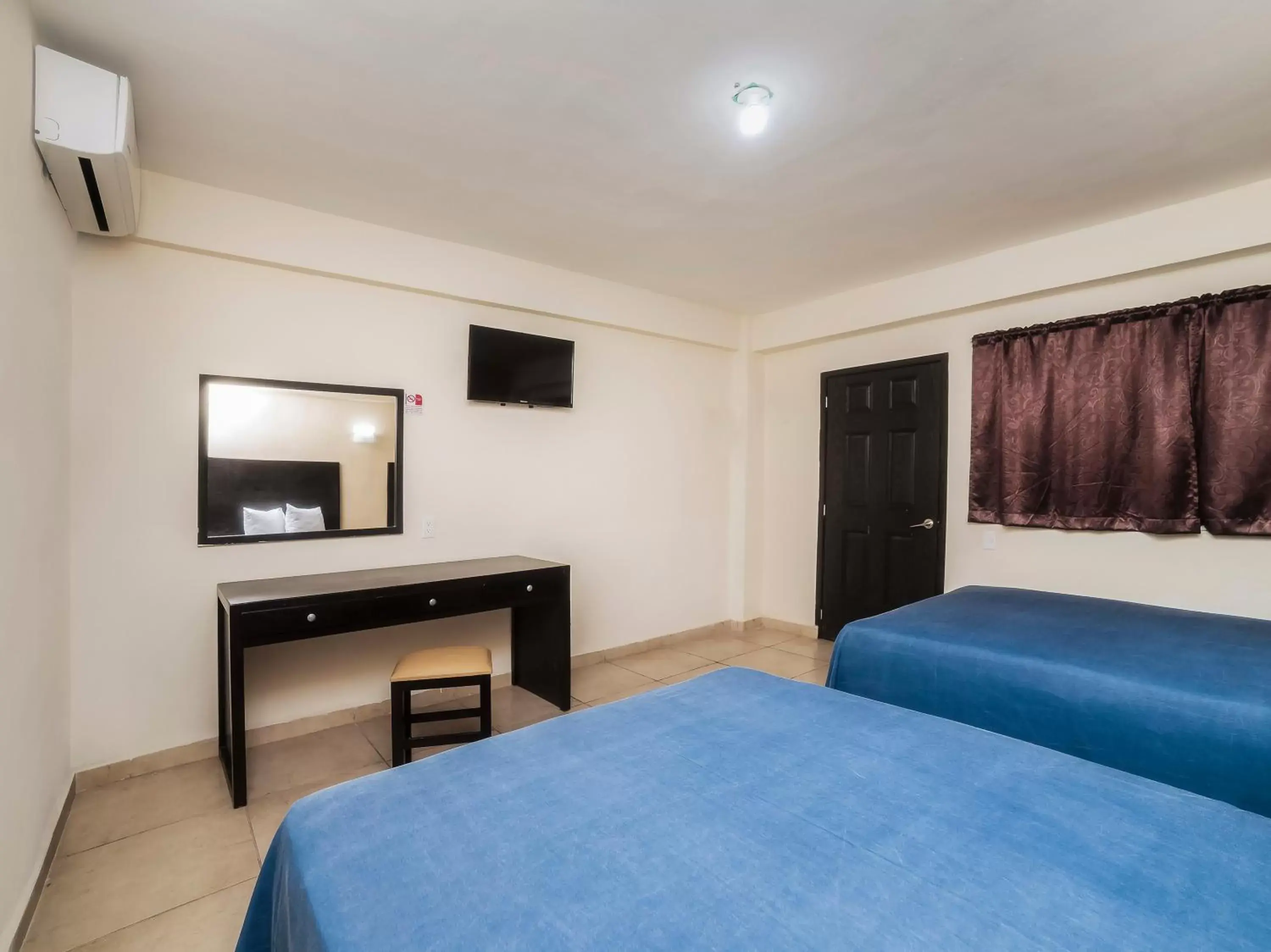 Bed in Hotel Puerto Inn