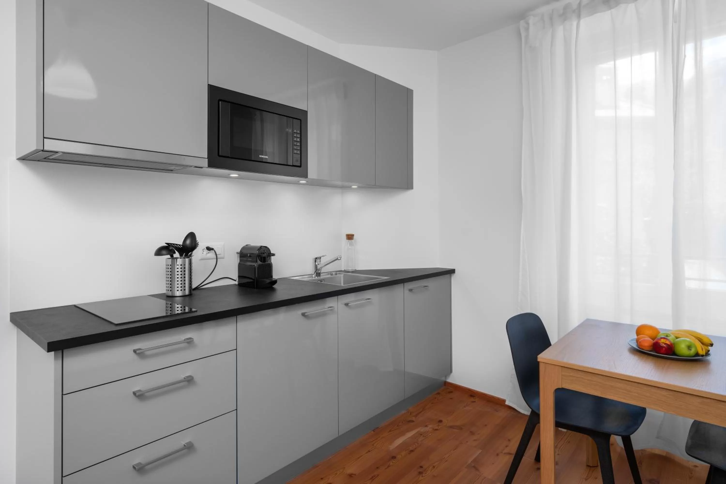 Kitchen or kitchenette in The Studios Montreux - Swiss Hotel Apartments