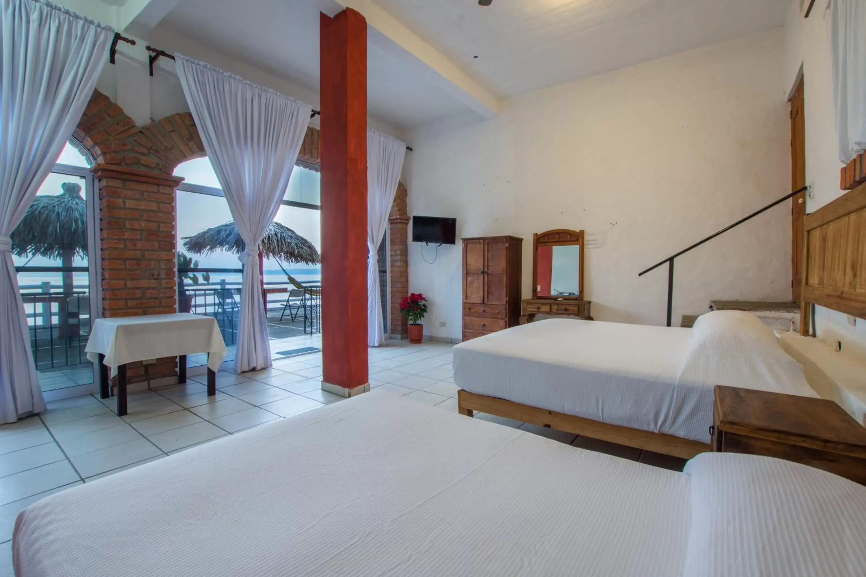 Bed in Traditional Sierra Leon Oceanfront Rooms - Adults Only