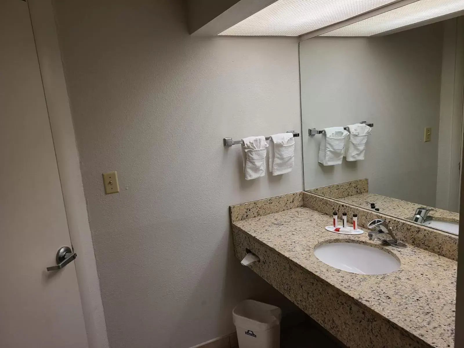 Bathroom in Days Inn & Suites by Wyndham Orlando East UCF Area