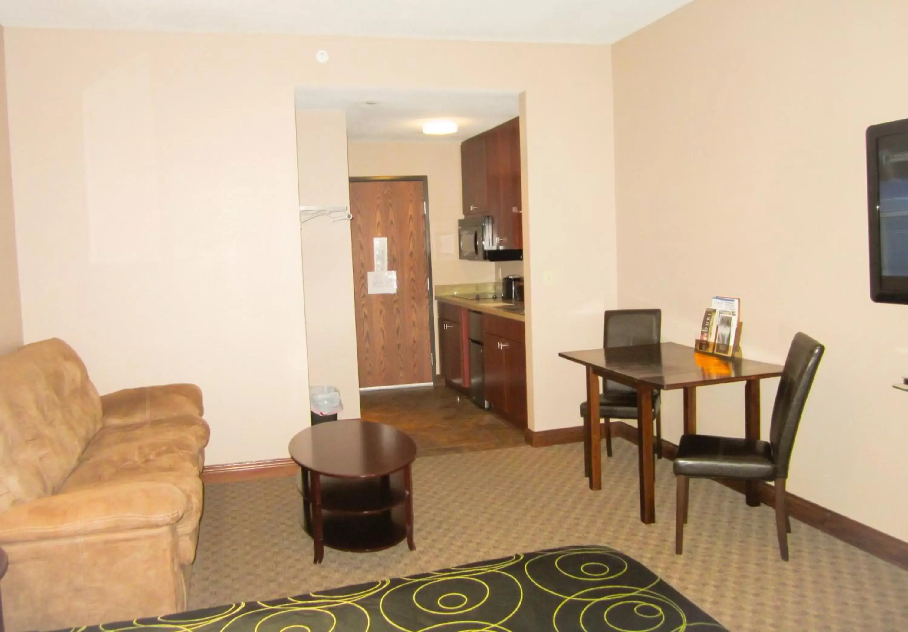 Photo of the whole room, Seating Area in Bell's Extended Stay and Suites