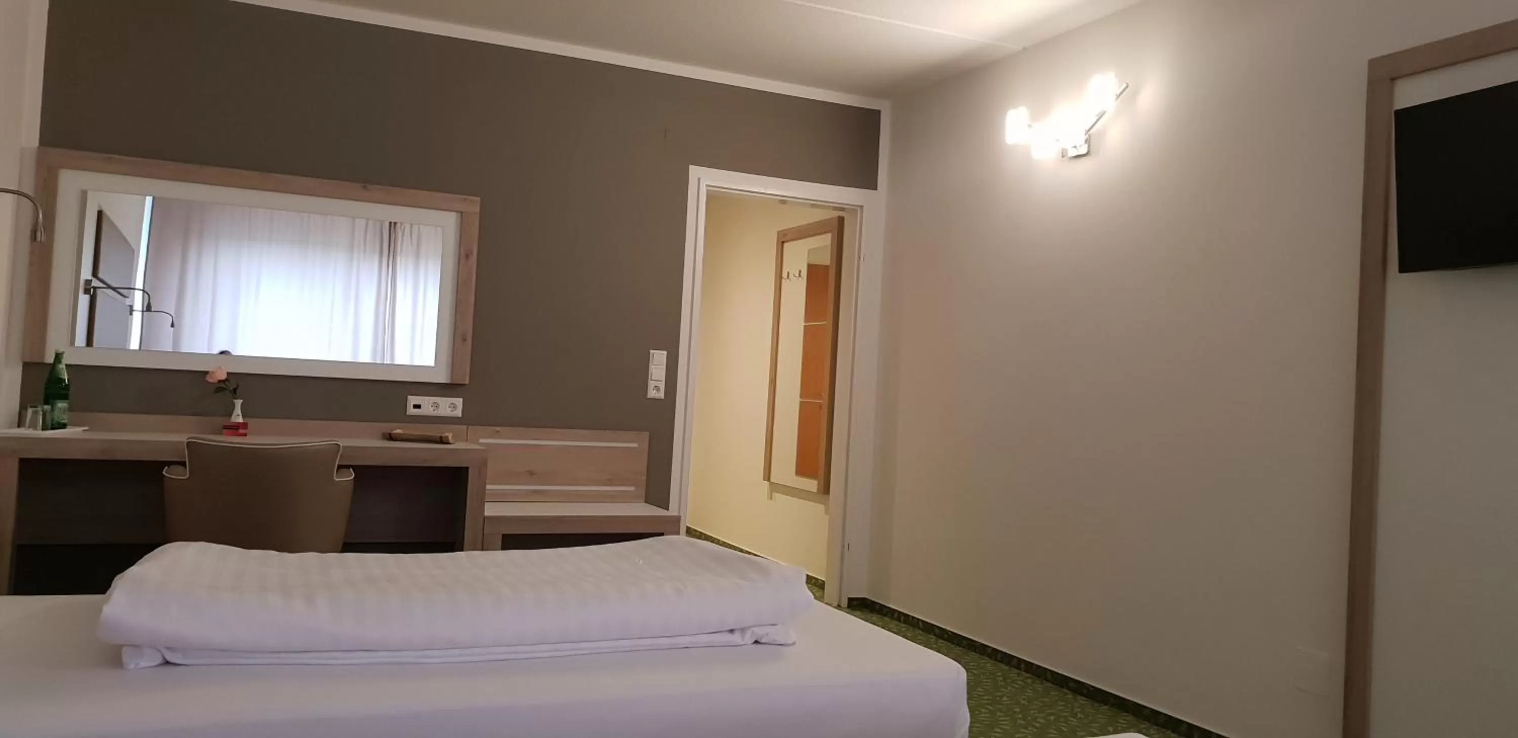 Bed in Confour Hotel