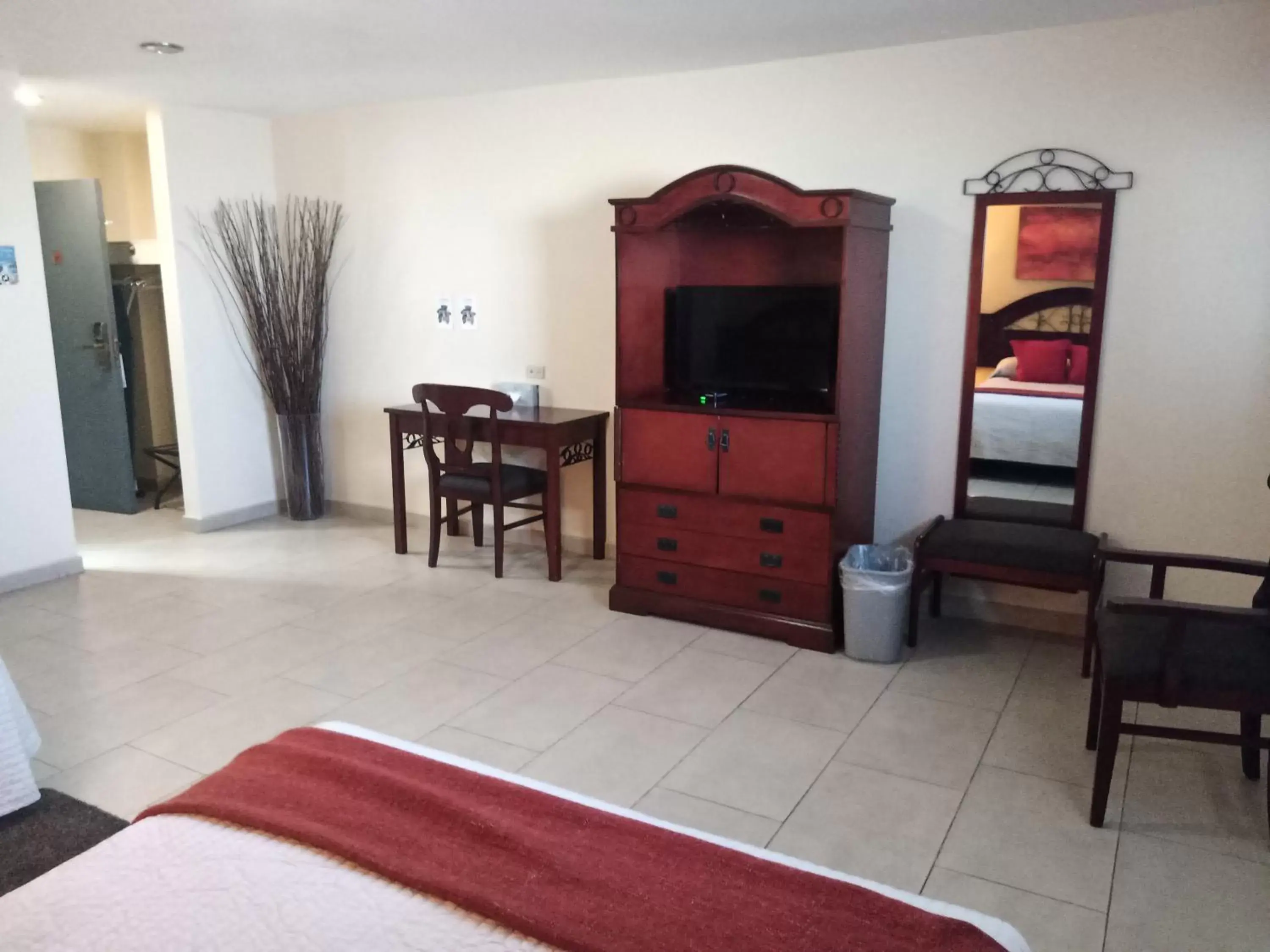 Photo of the whole room, TV/Entertainment Center in Baja Inn Hoteles La Mesa