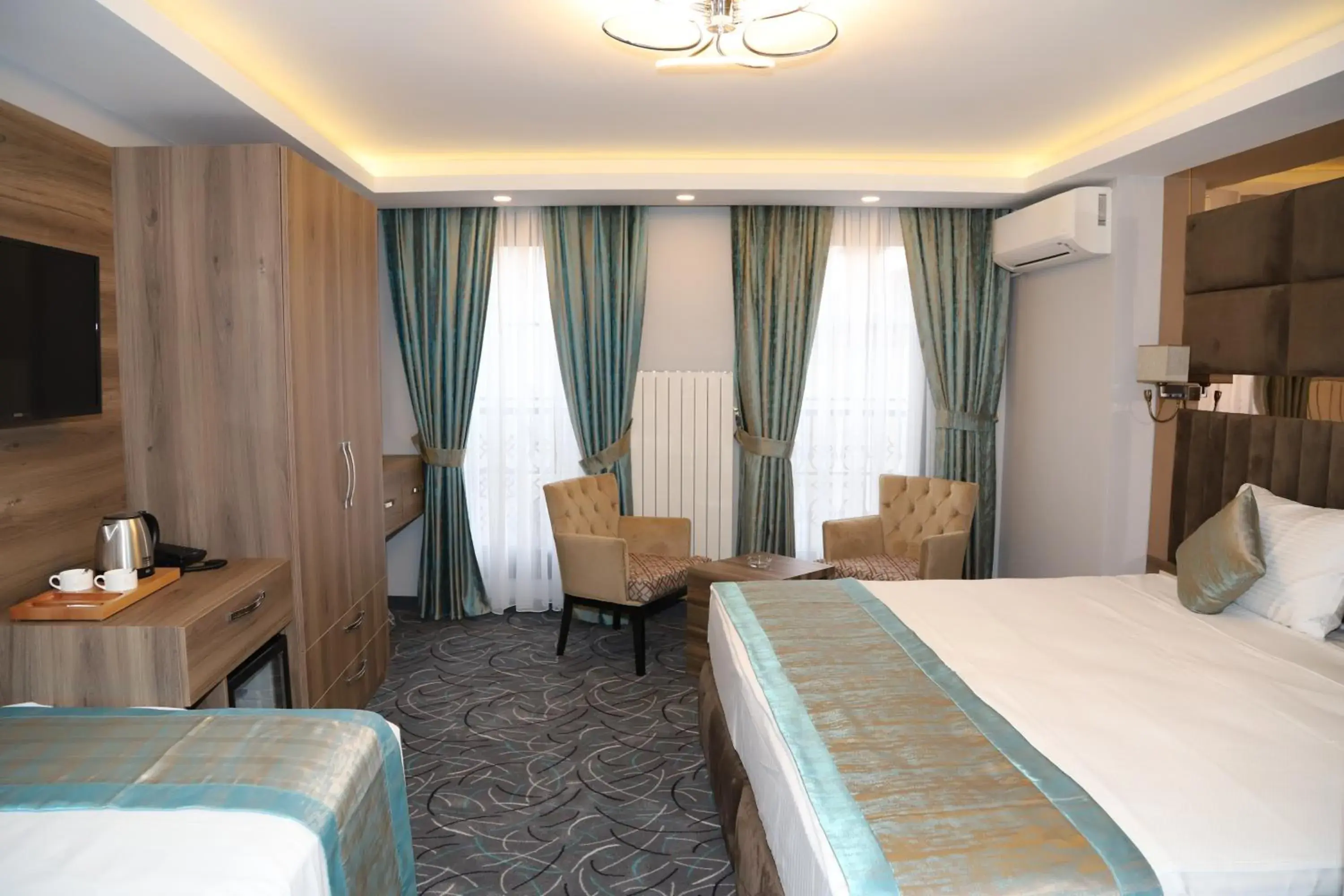 Bed in Grand Kavi Hotel