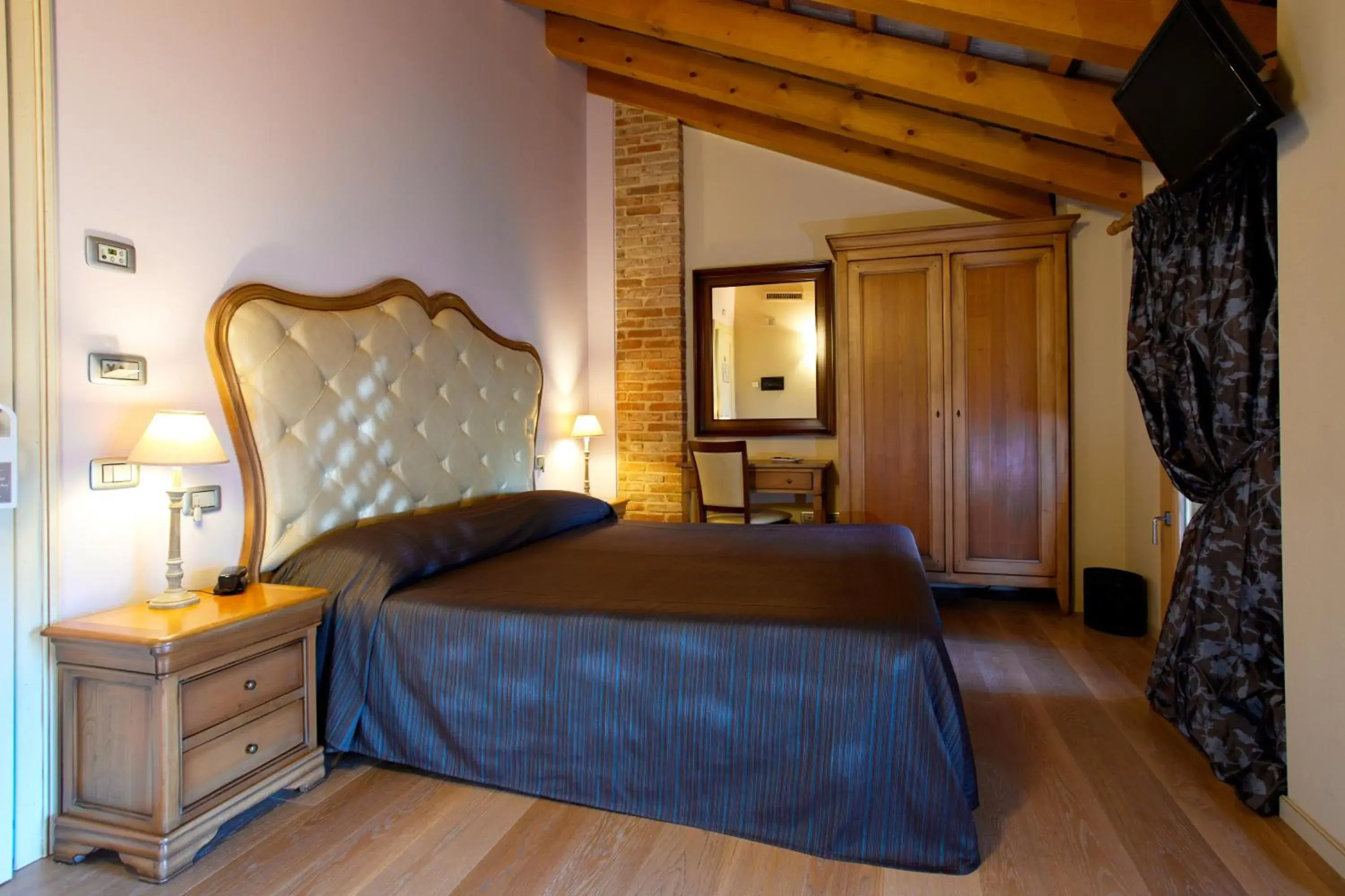 Bed in Hotel Asolo