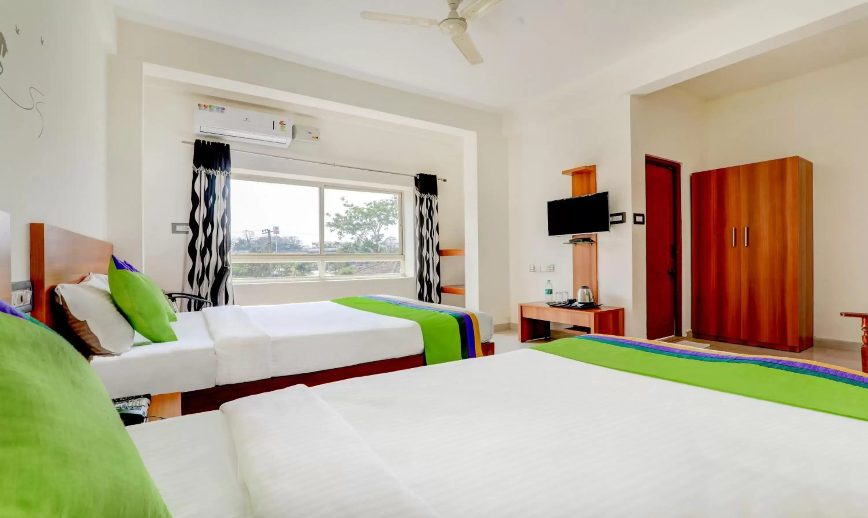 Bedroom, Bed in Treebo Atithi Comforts, 1 Km From Nisargadhama Forest Bedroom, Bed in Treebo Atithi Comforts, 1 Km From Nisargadhama Forest