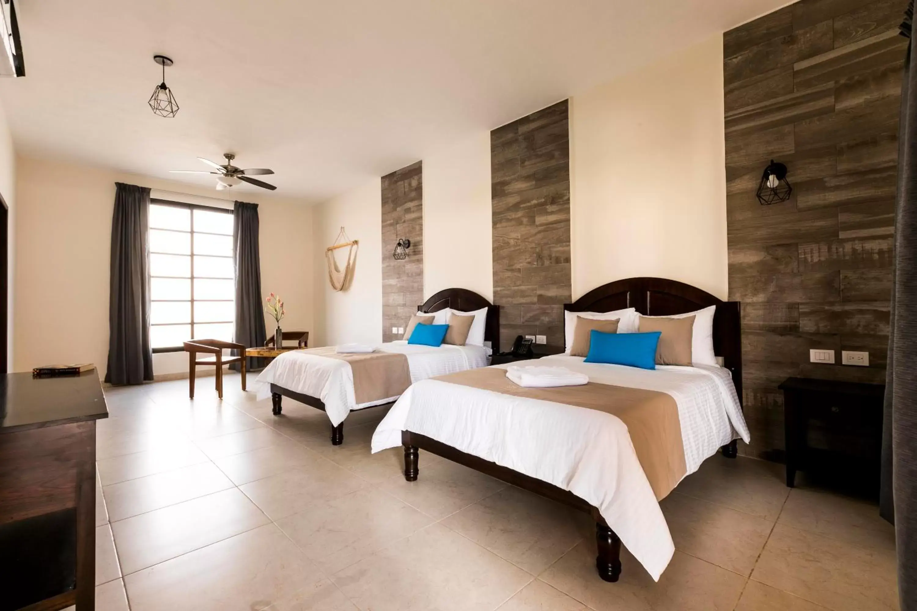 Junior Suite 1 king size bed and 1 double bed, living room, pool and garden view in Hotel Los Frailes, Valladolid, Yucatán Junior Suite 1 king size bed and 1 double bed, living room, pool and garden view in Hotel Los Frailes, Valladolid, Yucatán