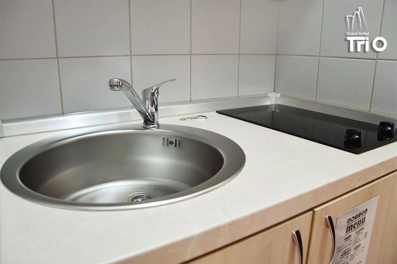 Kitchen or kitchenette in Garni Hotel Tri O