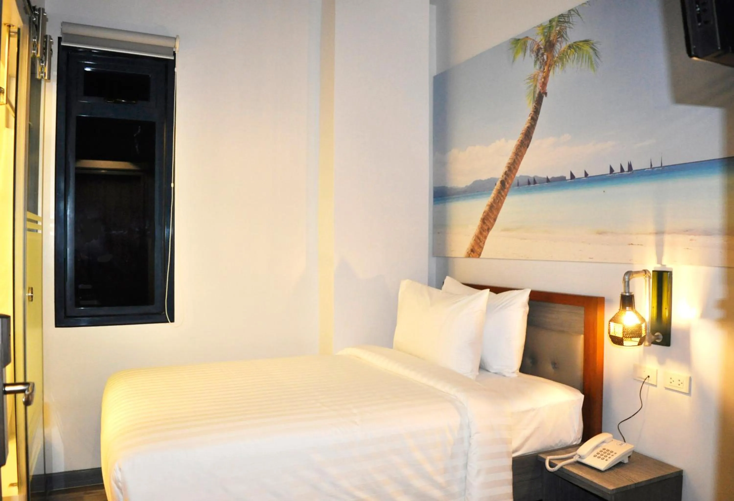 Photo of the whole room, Bed in GQ Plaza