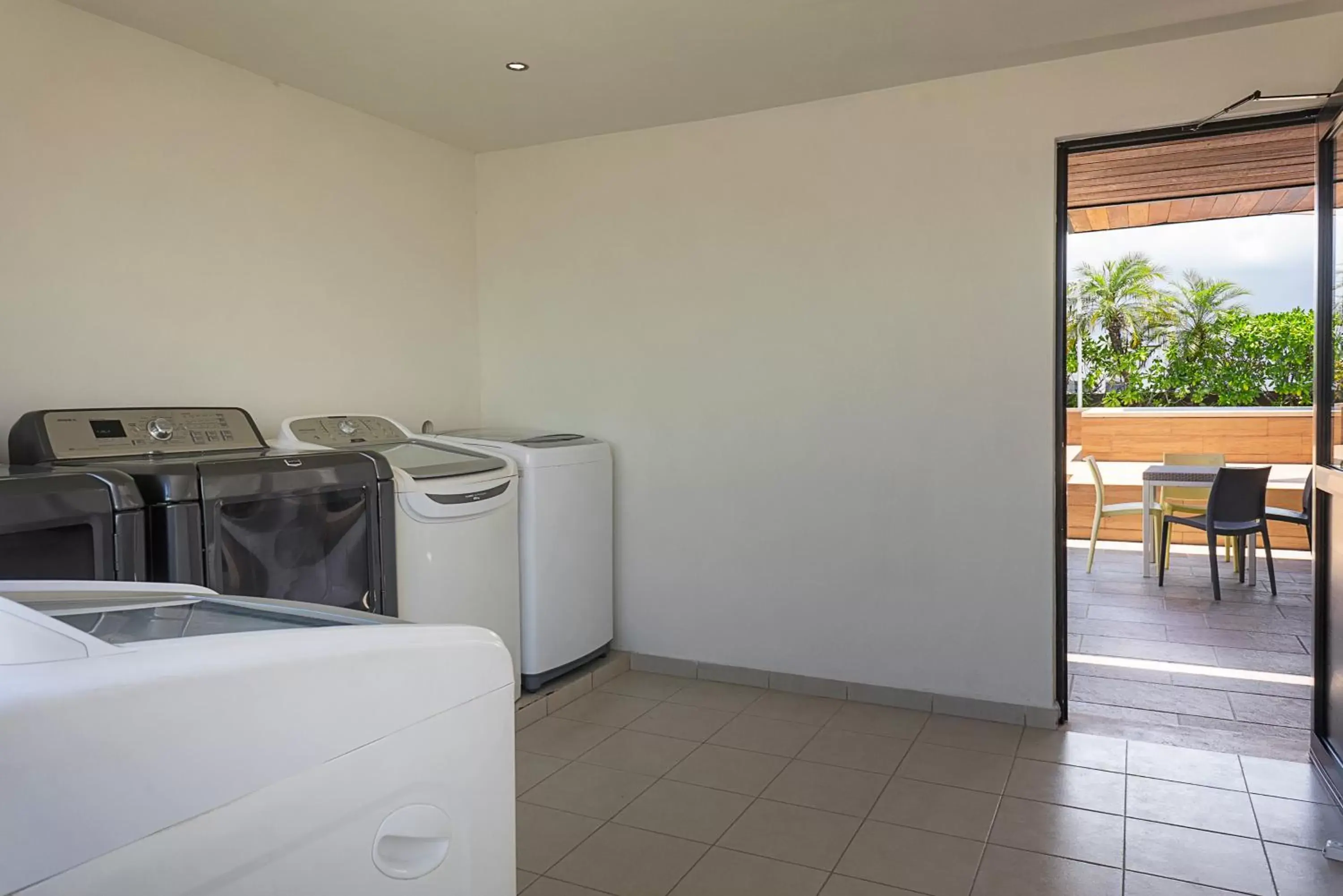 laundry, Kitchen/Kitchenette in Opal Suites Apartments