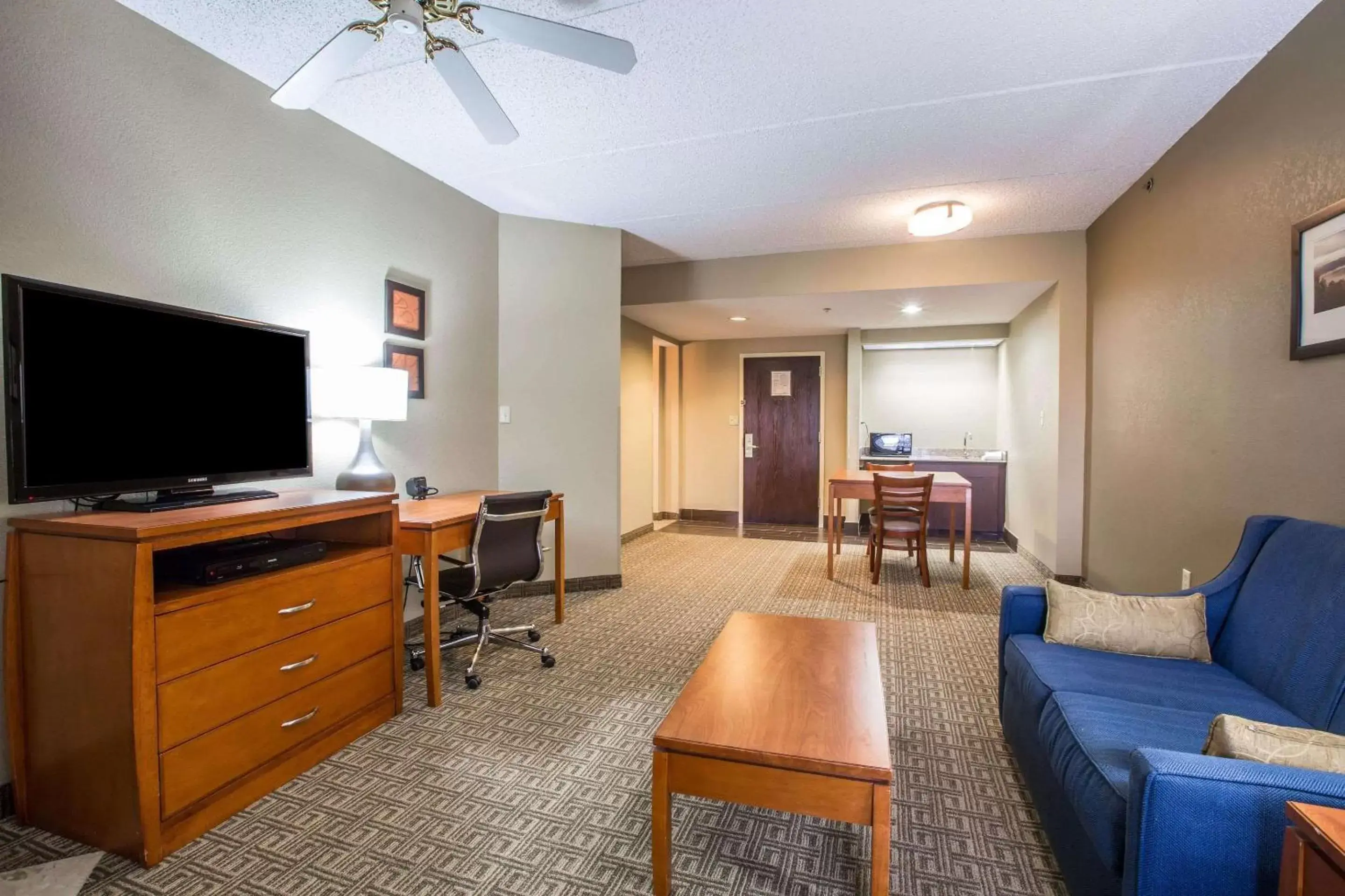 Photo of the whole room, TV/Entertainment Center in Vista Suites Hotel Near Island Drive And Convention Center