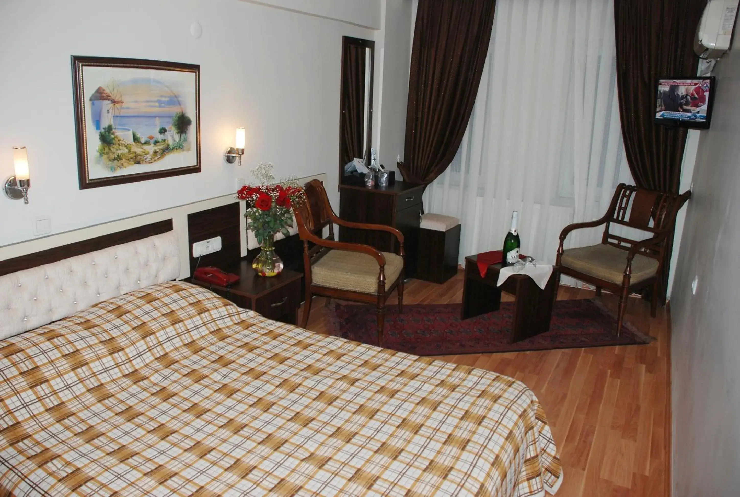 Bed, Seating Area in Grand Mark Hotel