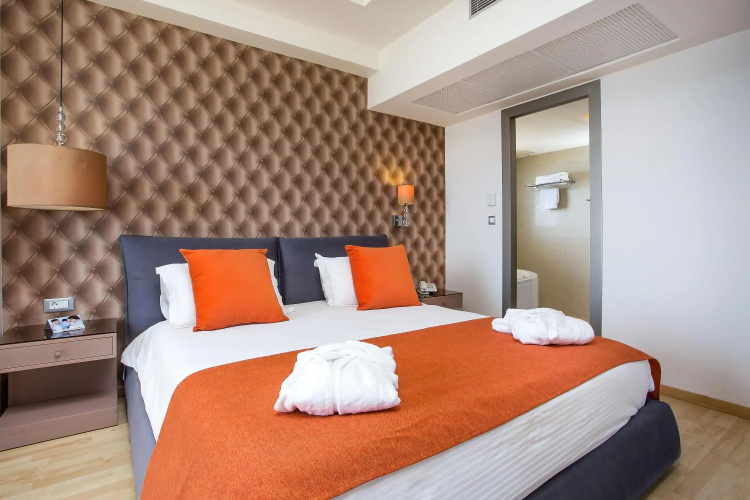 Bed in Pegasos Deluxe Beach Hotel