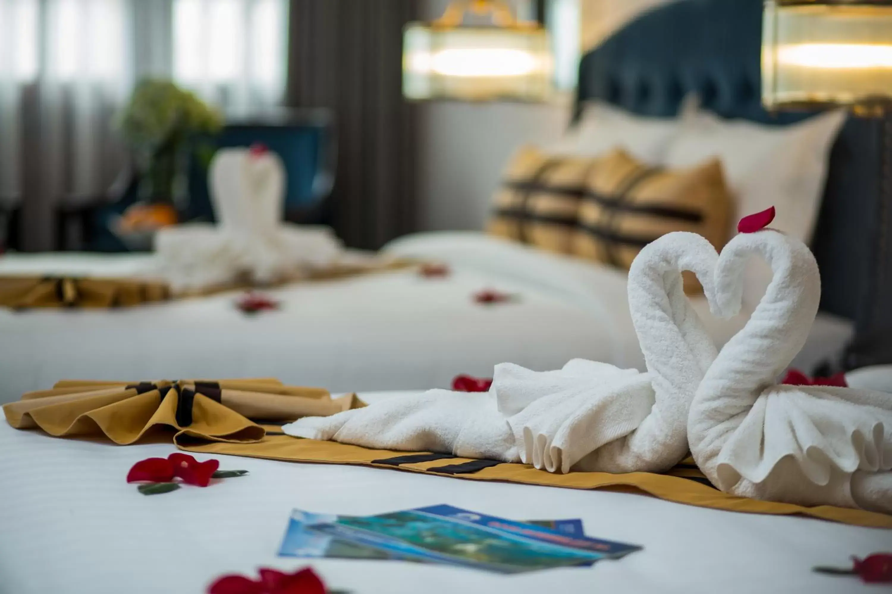 towels, Bed in S Central Hotel and Spa