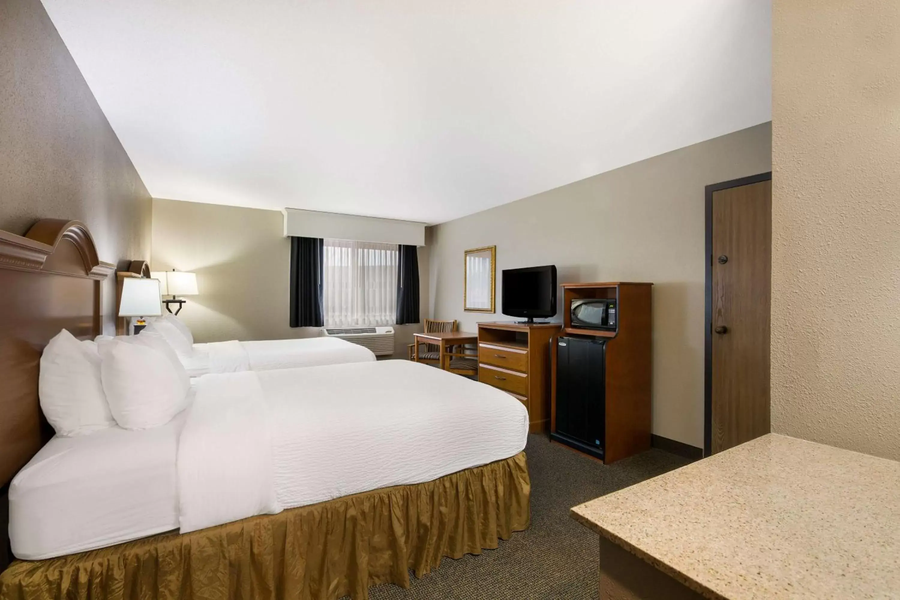 Bedroom, Bed in Revel Hotel Minot - SureStay Collection by Best Western