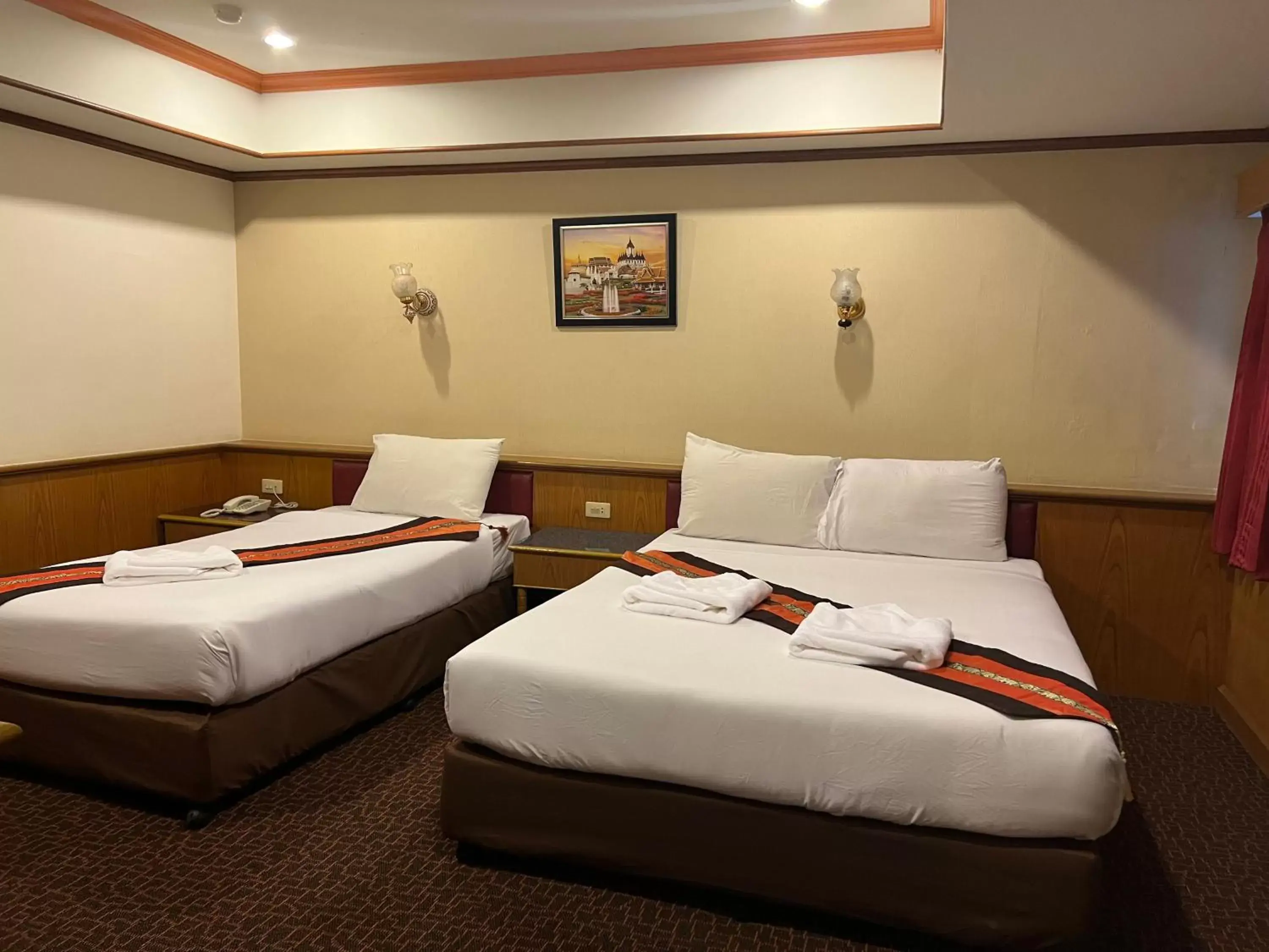 Bed in Merlin Grand Hotel