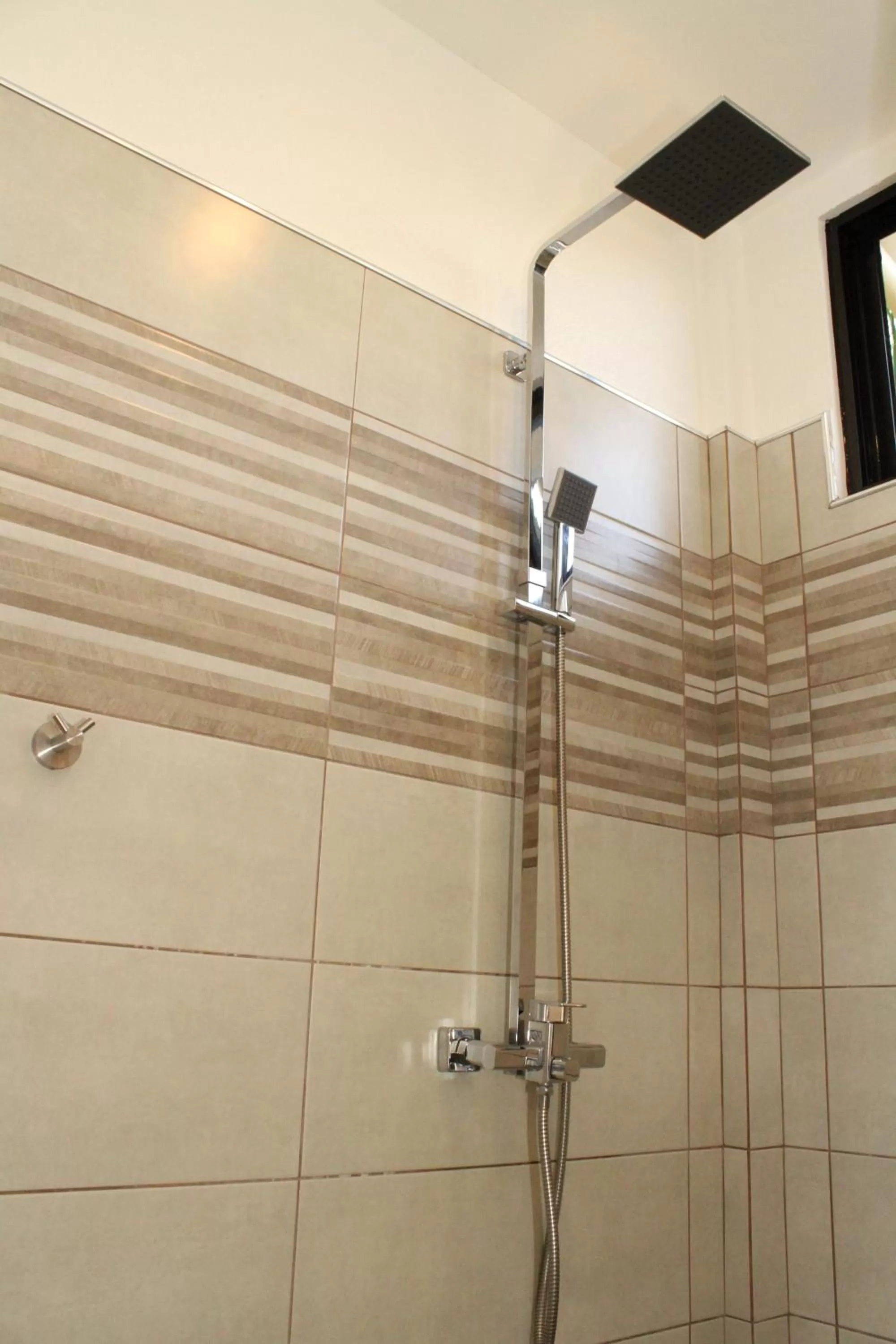 Shower in Alona's Coral Garden Resort (Adult-Only)